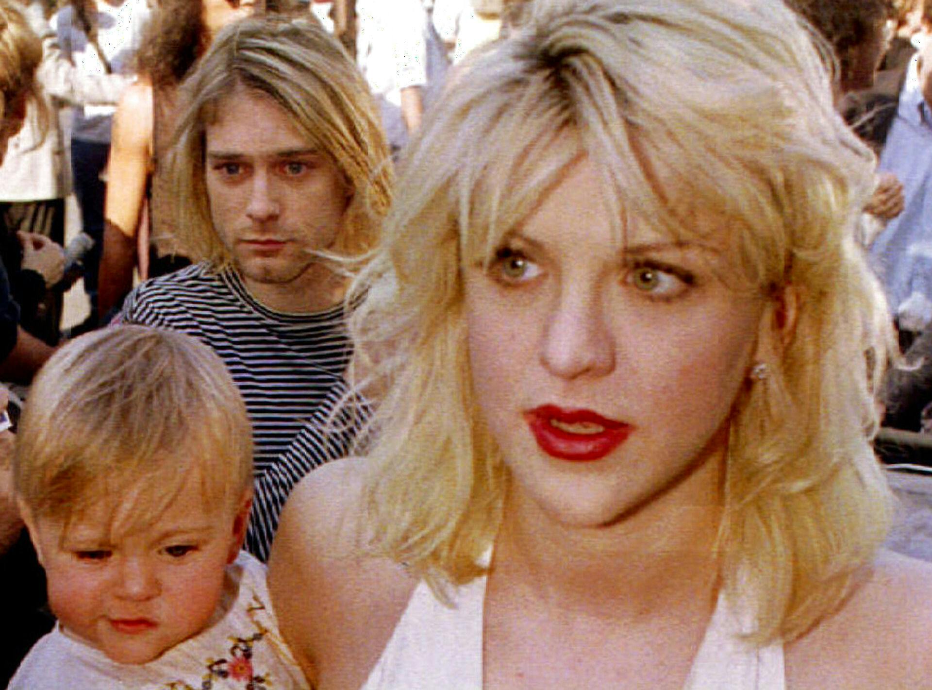 Arkivfoto fra 1992 af Kurt Cobain og Courtney Love med datteren, Frances Bean Cobain.