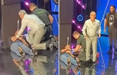 Her ligger Simon Cowell, mens Bruno Tonioli er styrtet hen til ham efter at have kastet armbrøsten til siden.