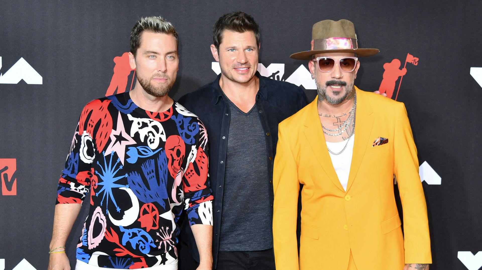 AJ McLean (h), her fotograferet med sangerne Lace Bass og Nick Lachey, skal skilles.