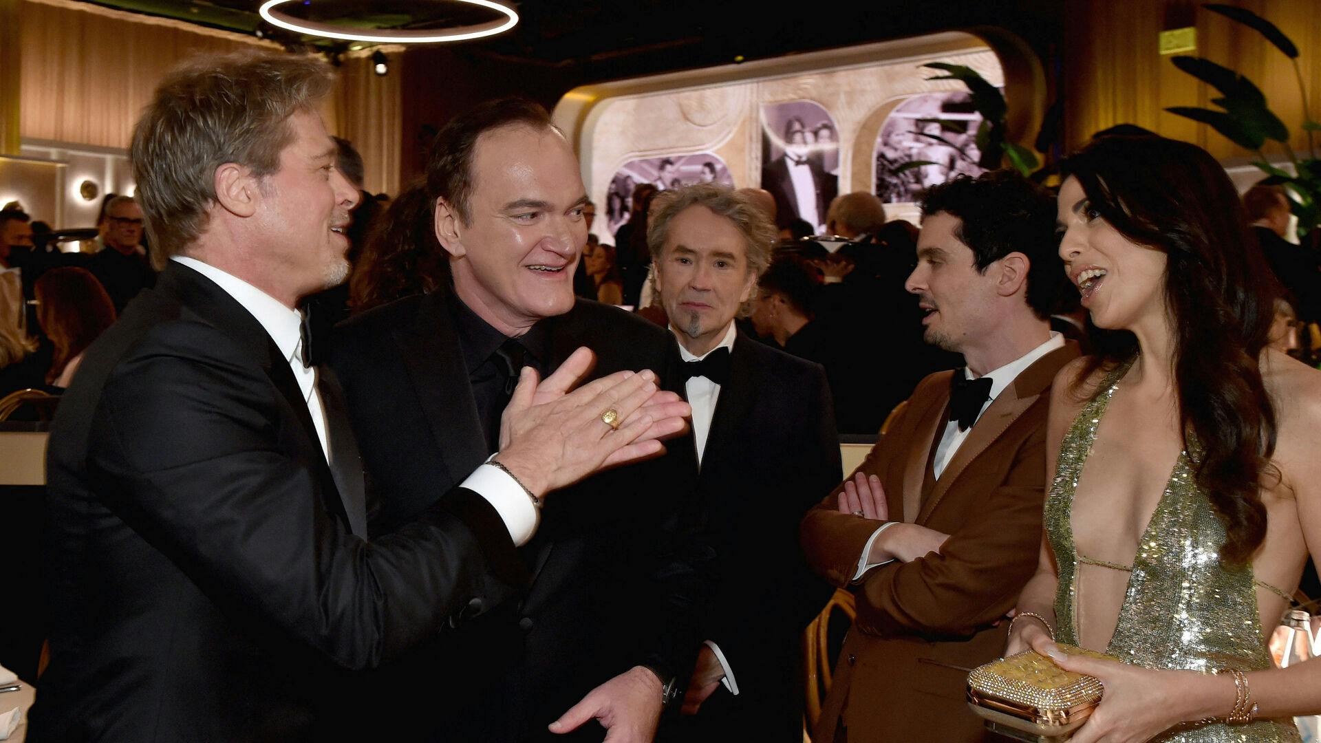 Quentin Tarantino er næsten lige så berømt som sine skuespillere. Her ses han sammen med vennen Brad Pitt og Daniella Pick.