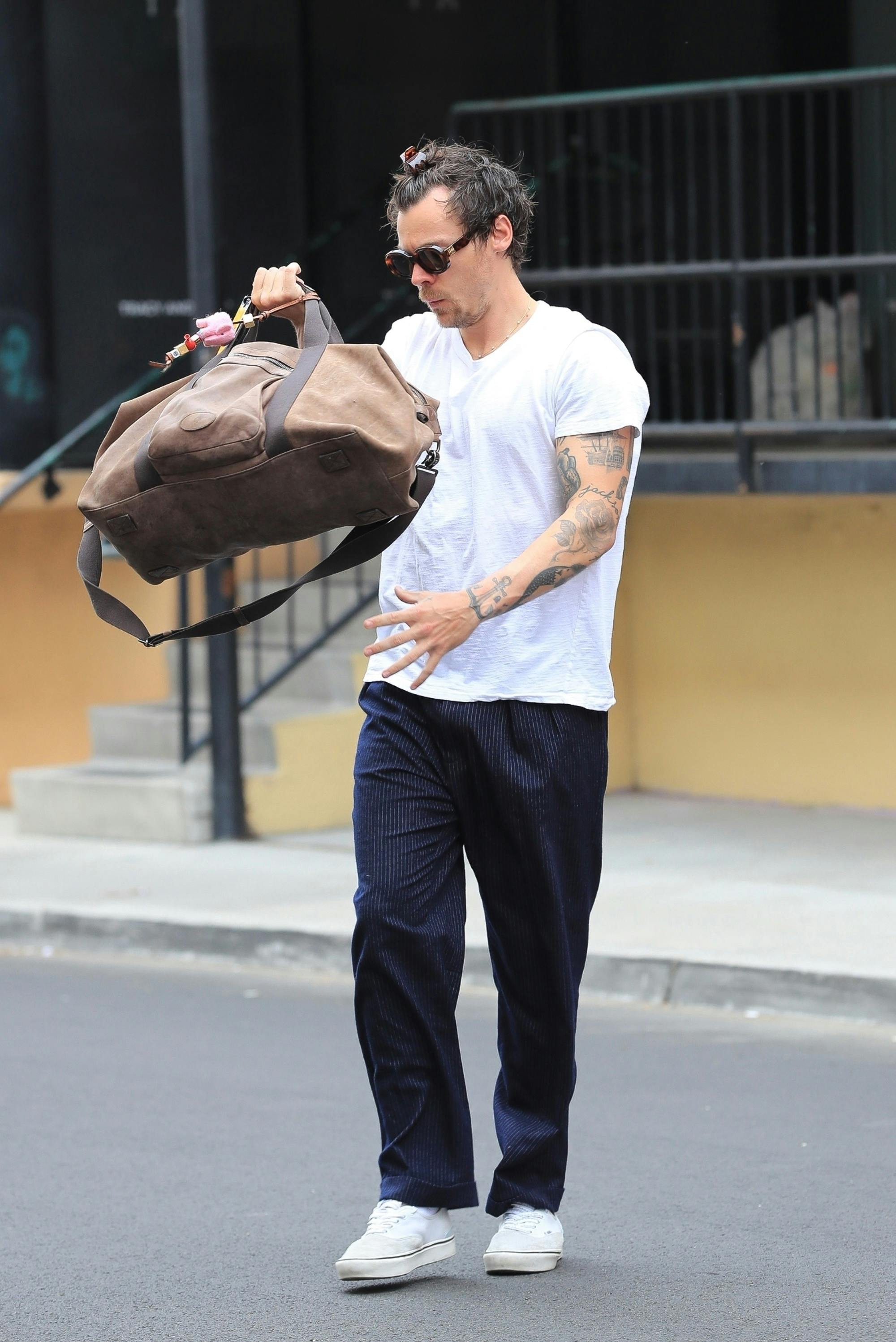 Harry Styles fortsætter med at træne i det samme træningscenter, selv om der er risiko for at løbe ind i eks'en. 