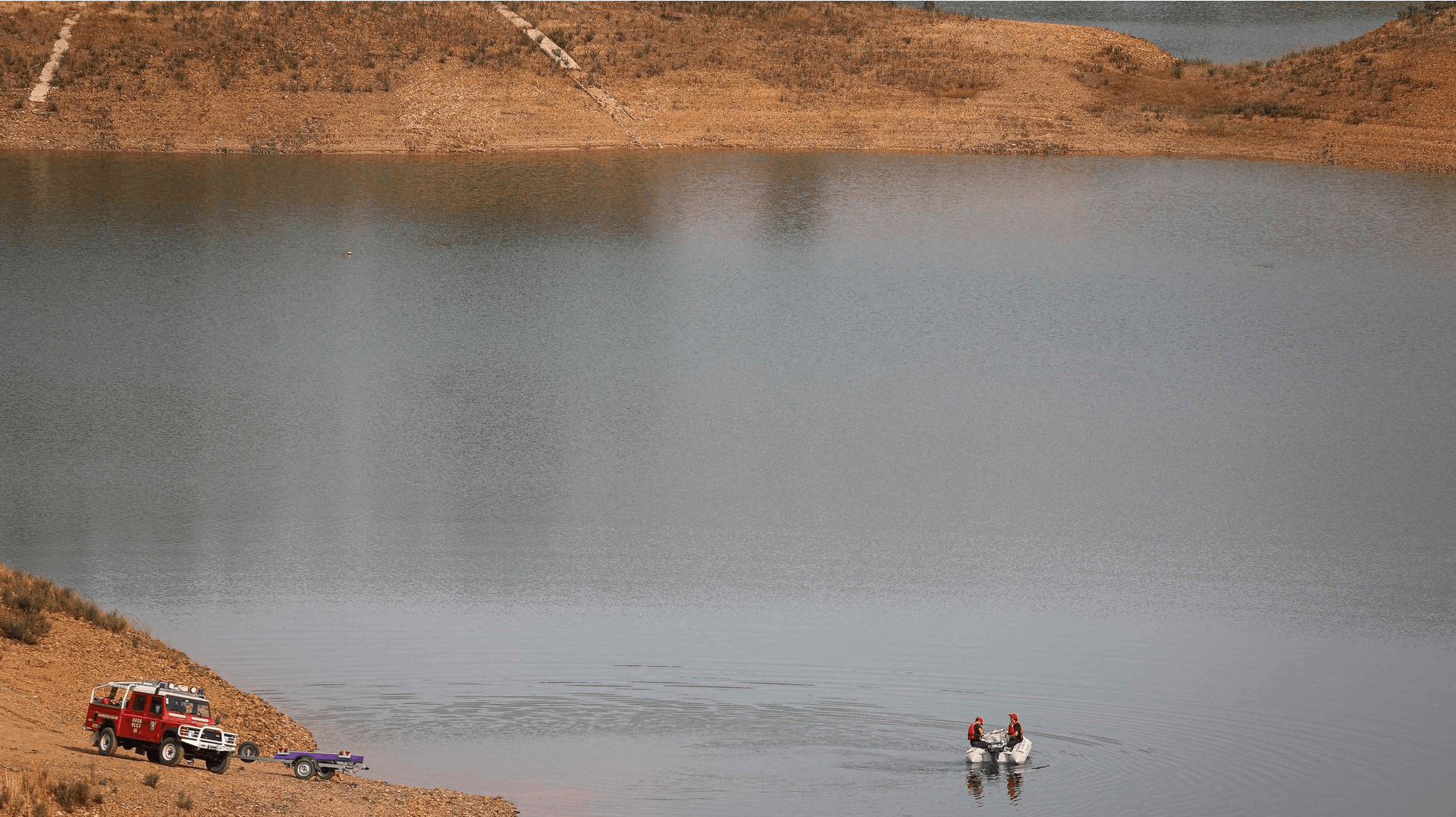 Portuguese authorities from the Judicial Police (PJ) criminal investigation unit work onboard a boat during a new search operation amid the investigation into the disappearance of Madeleine McCann (Maddie) in the Arade dam area, in Silves, near Praia da L