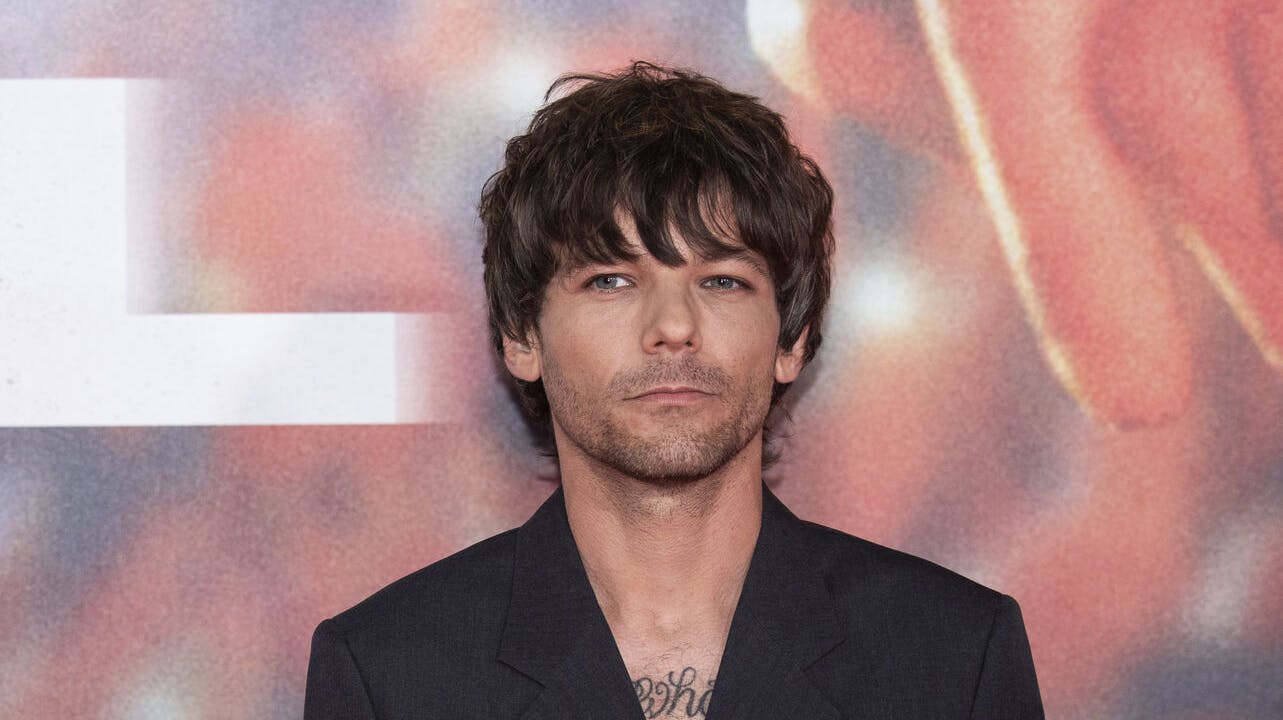 Louis Tomlinson poses for photographers upon arrival at the premiere of the film 'All of Those Voices' in London Thursday, March 16, 2023. (Photo by Vianney Le Caer/Invision/AP)