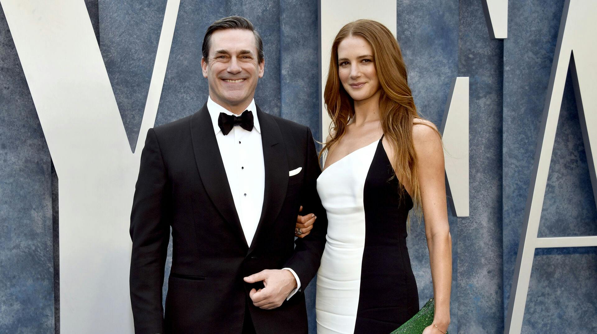 Jon Hamm, left, and Anna Osceola arrive at the Vanity Fair Oscar Party on Sunday, March 12, 2023, at the Wallis Annenberg Center for the Performing Arts in Beverly Hills, Calif. (Photo by Evan Agostini/Invision/AP)