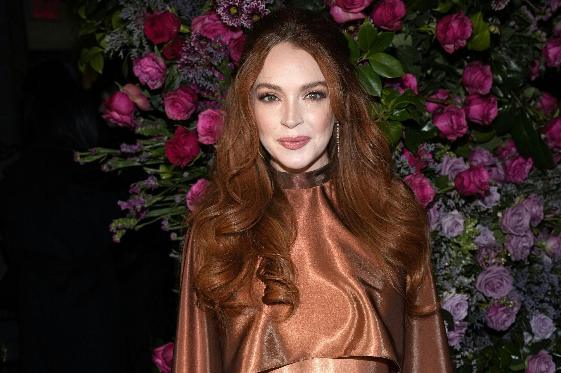 Lindsay Lohan attends the Christian Siriano Fall/Winter 2023 fashion show at Gotham Hall on Thursday, Feb. 9, 2023, in New York. (Photo by Charles Sykes/Invision/AP)