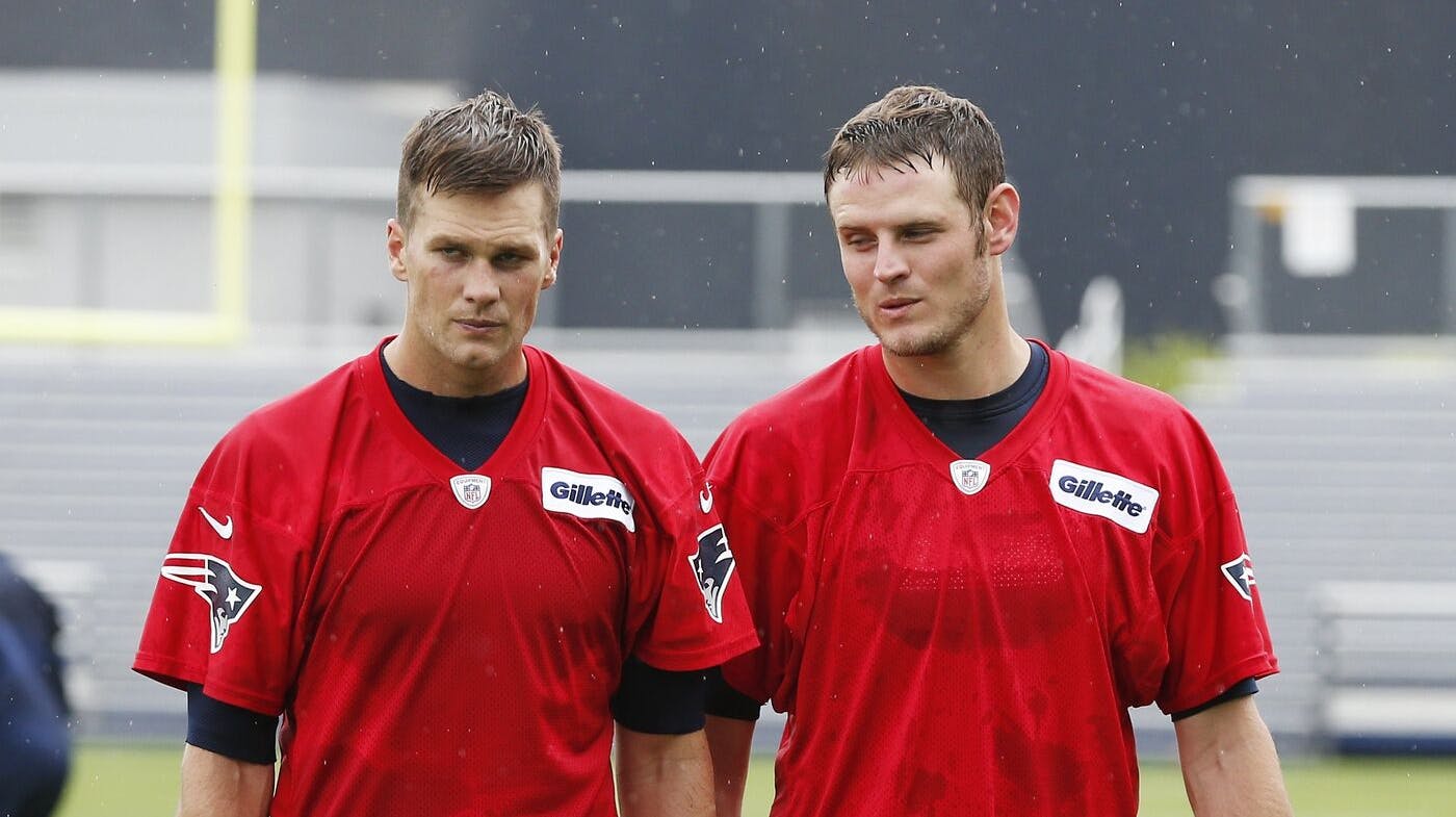 New England Patriots quarterbacks Tom Brady, left, and Ryan Mallet walk off the field after team football practice in Foxborough, Mass., Wednesday, May 29, 2013. (AP Photo/Michael Dwyer)