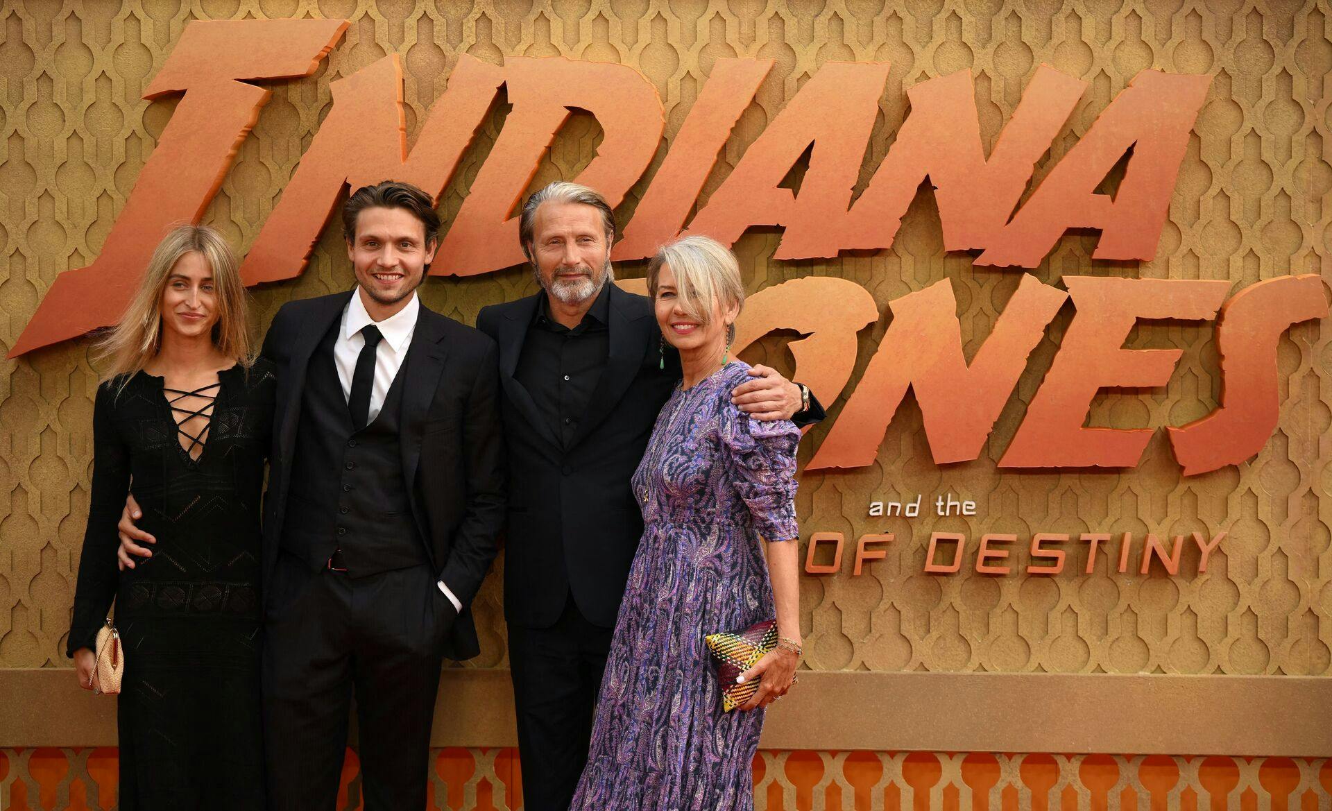 Danish actor Mads Mikkelsen (2R) poses on the red carpet upon arrival for the UK Premiere of "Indiana Jones and the Dial of Destiny", at the Cineworld Leicester Square, central London, on June 26, 2023. (Photo by Daniel LEAL / AFP)