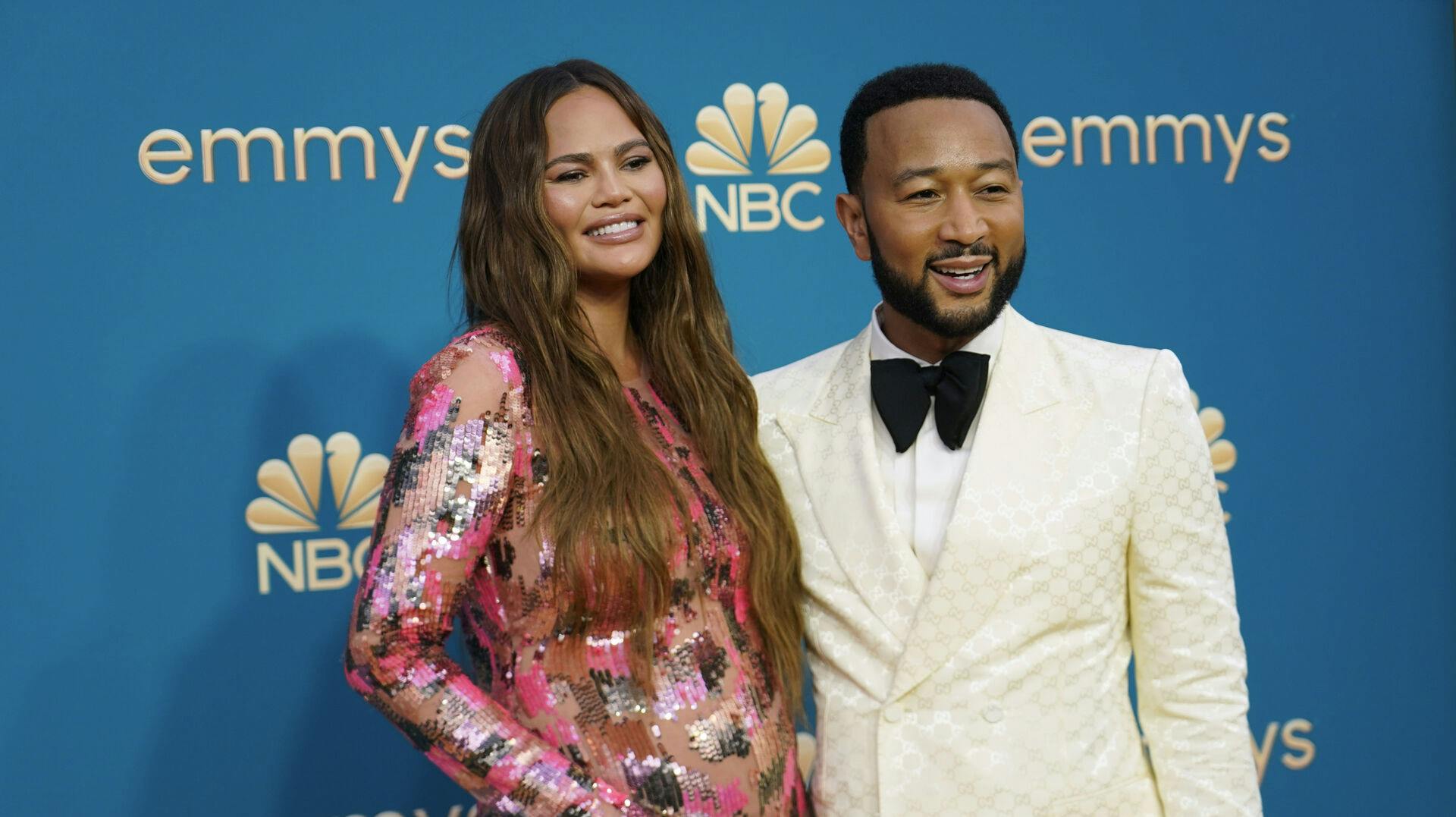 Chrissy Teigen, left, and John Legend arrive at the 74th Primetime Emmy Awards on Monday, Sept. 12, 2022, at the Microsoft Theater in Los Angeles. (AP Photo/Jae C. Hong)