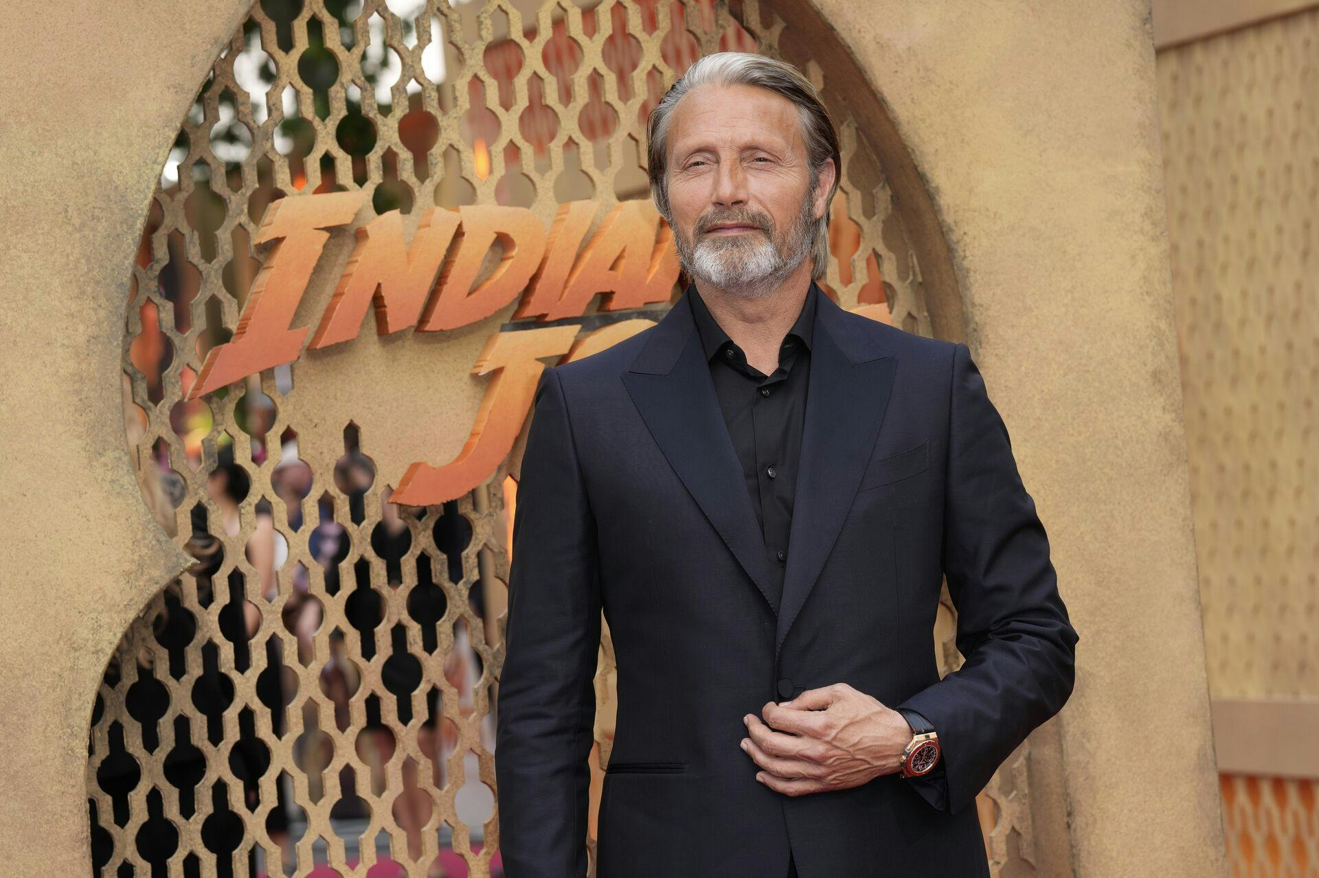 Mads Mikkelsen poses for photographers upon arrival at the premiere of the film 'Indiana Jones and the Dial of Destiny' on Monday, June 26, 2023 in London. (Scott Garfitt/Invision/AP)