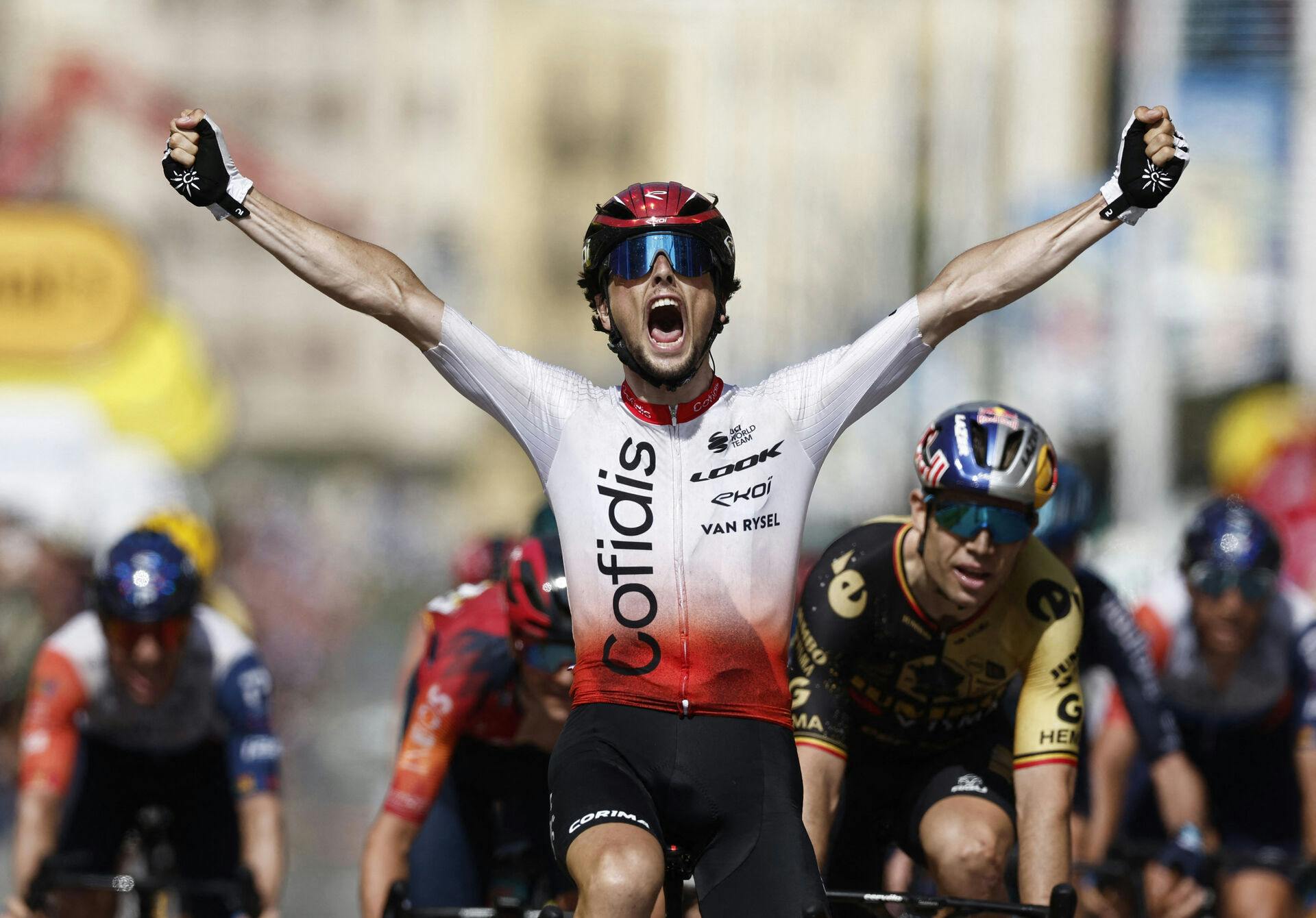 Cycling - Tour de France - Stage 2 - Vitoria Gasteiz to San Sebastian - Spain - July 2, 2023 Cofidis' Victor Lafay celebrates as he crosses the finish line to win stage 2 REUTERS/Benoit Tessier