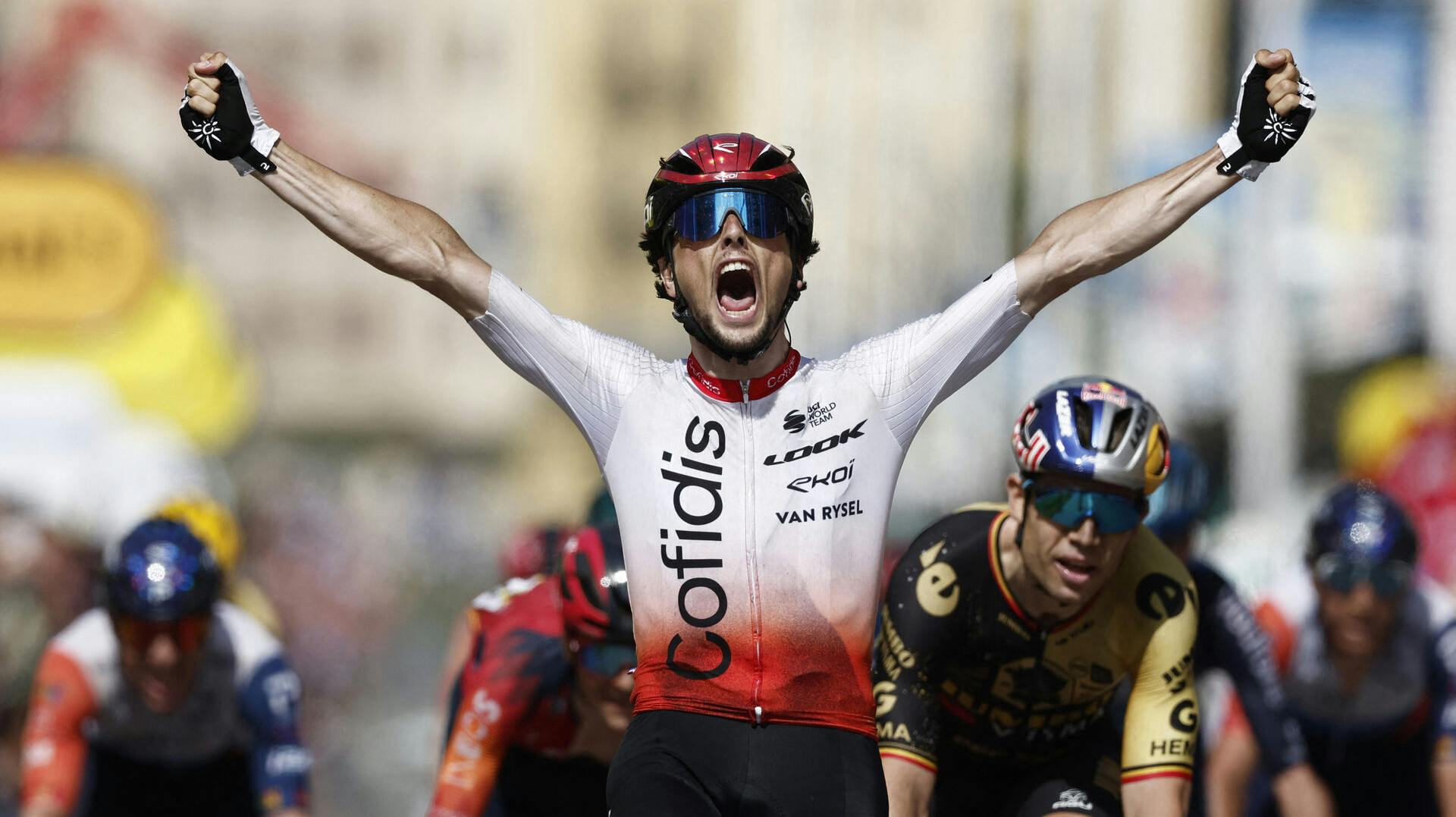Cycling - Tour de France - Stage 2 - Vitoria Gasteiz to San Sebastian - Spain - July 2, 2023 Cofidis' Victor Lafay celebrates as he crosses the finish line to win stage 2 REUTERS/Benoit Tessier