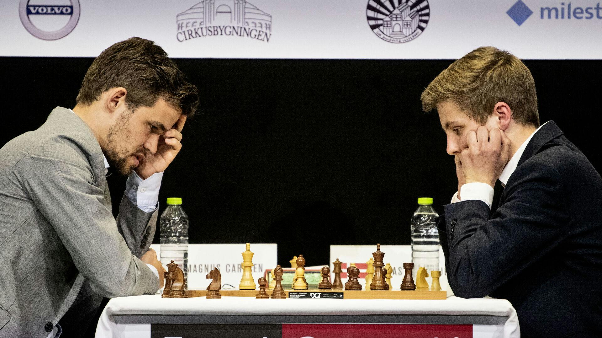 Skakstjernen Magnus Carlsen (t.v.) har tidligere haft glæde af de dybe lommer hos Energi Danmark. Om tre nu tidligere ansatte kan hente 900 millioner kroner op af energigigantens pengekasse er derimod mere tvivlsomt.
