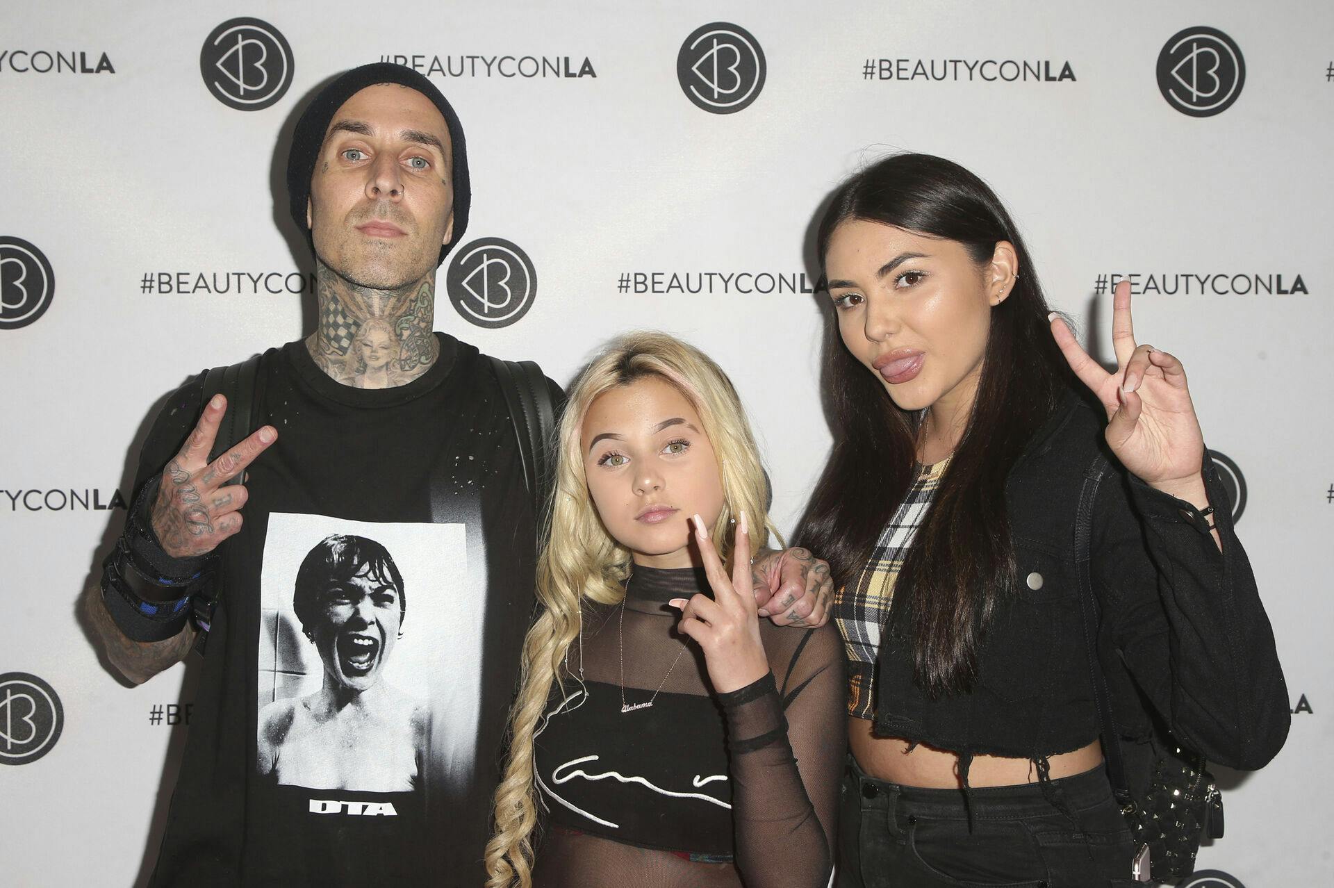 LOS ANGELES, CA - JULY 14: Travis Barker, Alabama Luella Barker, Atiana de la Hoya, at day one of the 5th Annual Beautycon Festival LA 2018 at the Los Angeles Convention Center in Los Angeles, California on July 14, 2018. Credit: Faye Sadou/MediaPunch /IPX