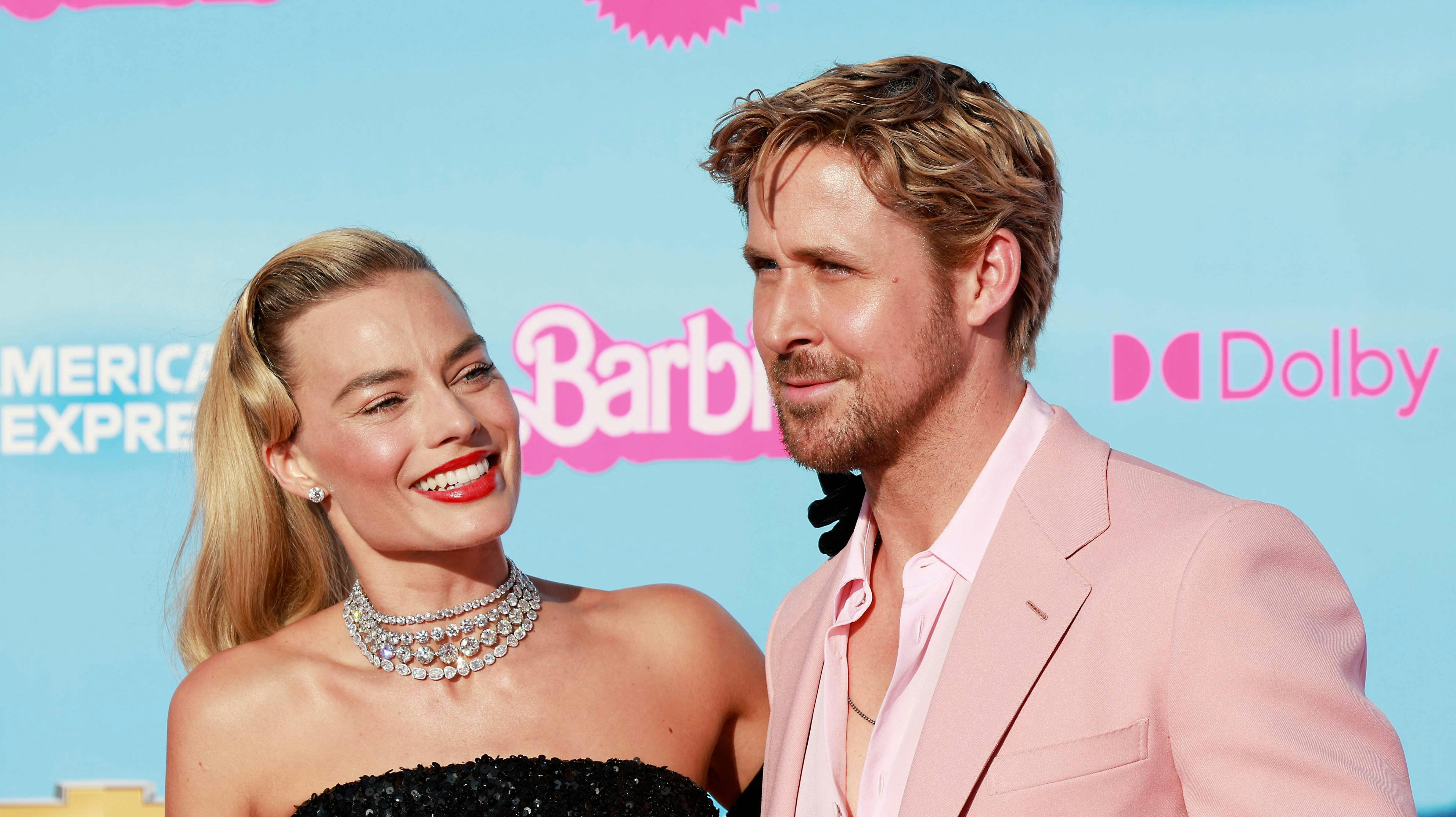 Australian actress Margot Robbie and Canadian-US actor Ryan Reynolds arrive for the world premiere of "Barbie" at the Shrine Auditorium in Los Angeles, on July 9, 2023. (Photo by Michael Tran / AFP)