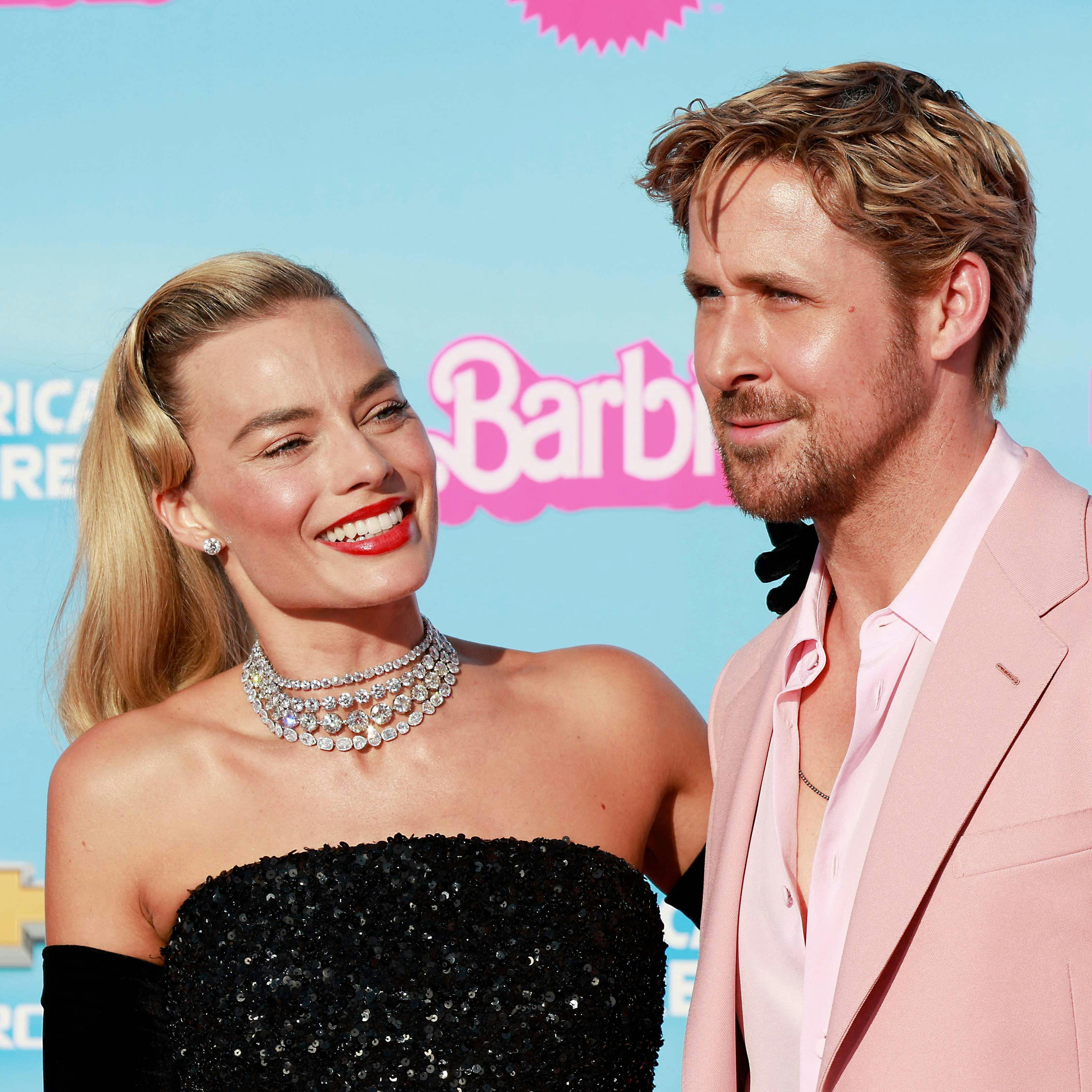 Australian actress Margot Robbie and Canadian-US actor Ryan Reynolds arrive for the world premiere of "Barbie" at the Shrine Auditorium in Los Angeles, on July 9, 2023. (Photo by Michael Tran / AFP)