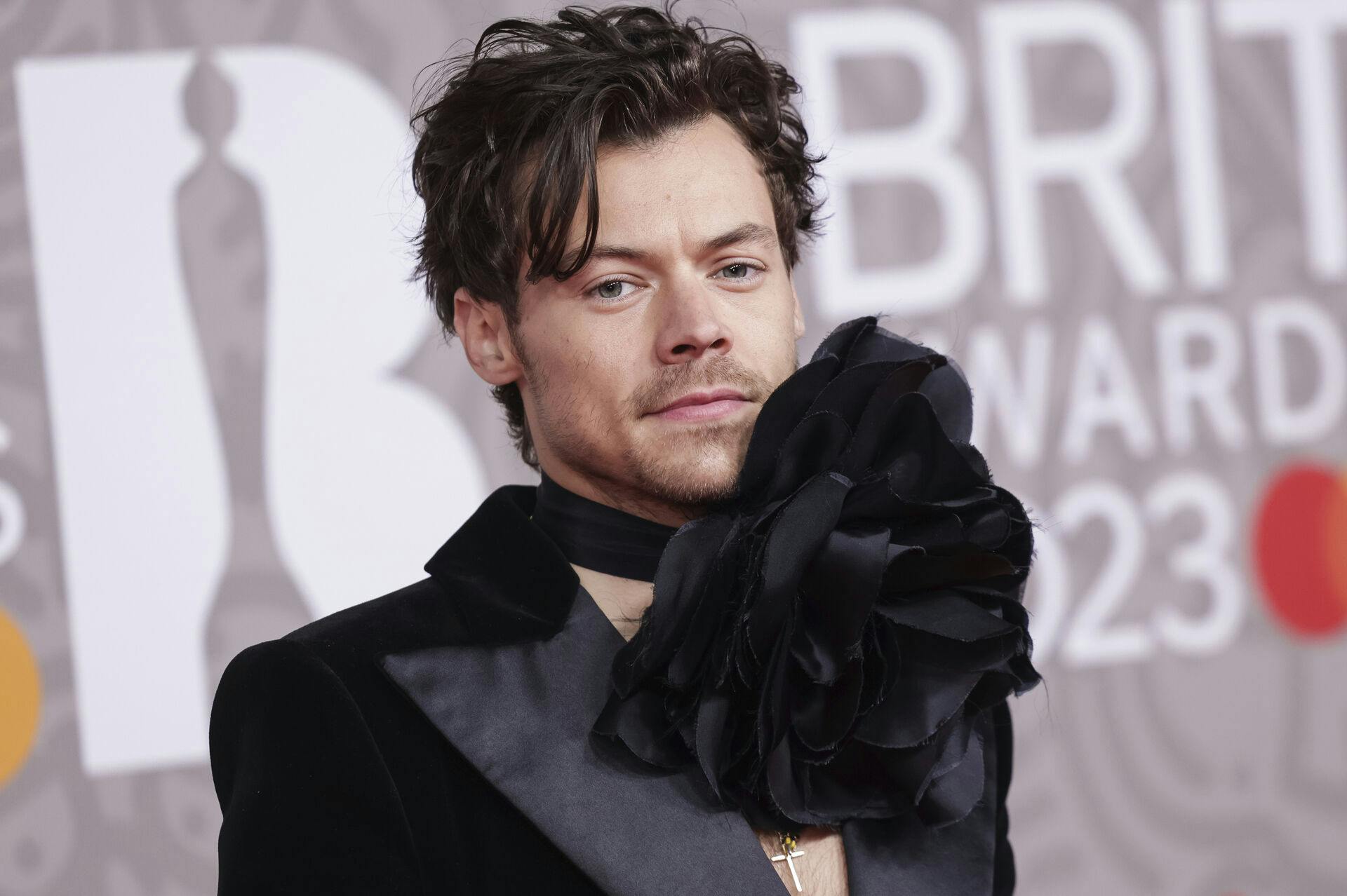 Harry Styles poses for photographers upon arrival at the Brit Awards 2023 in London, Saturday, Feb. 11, 2023. (Photo by Vianney Le Caer/Invision/AP)