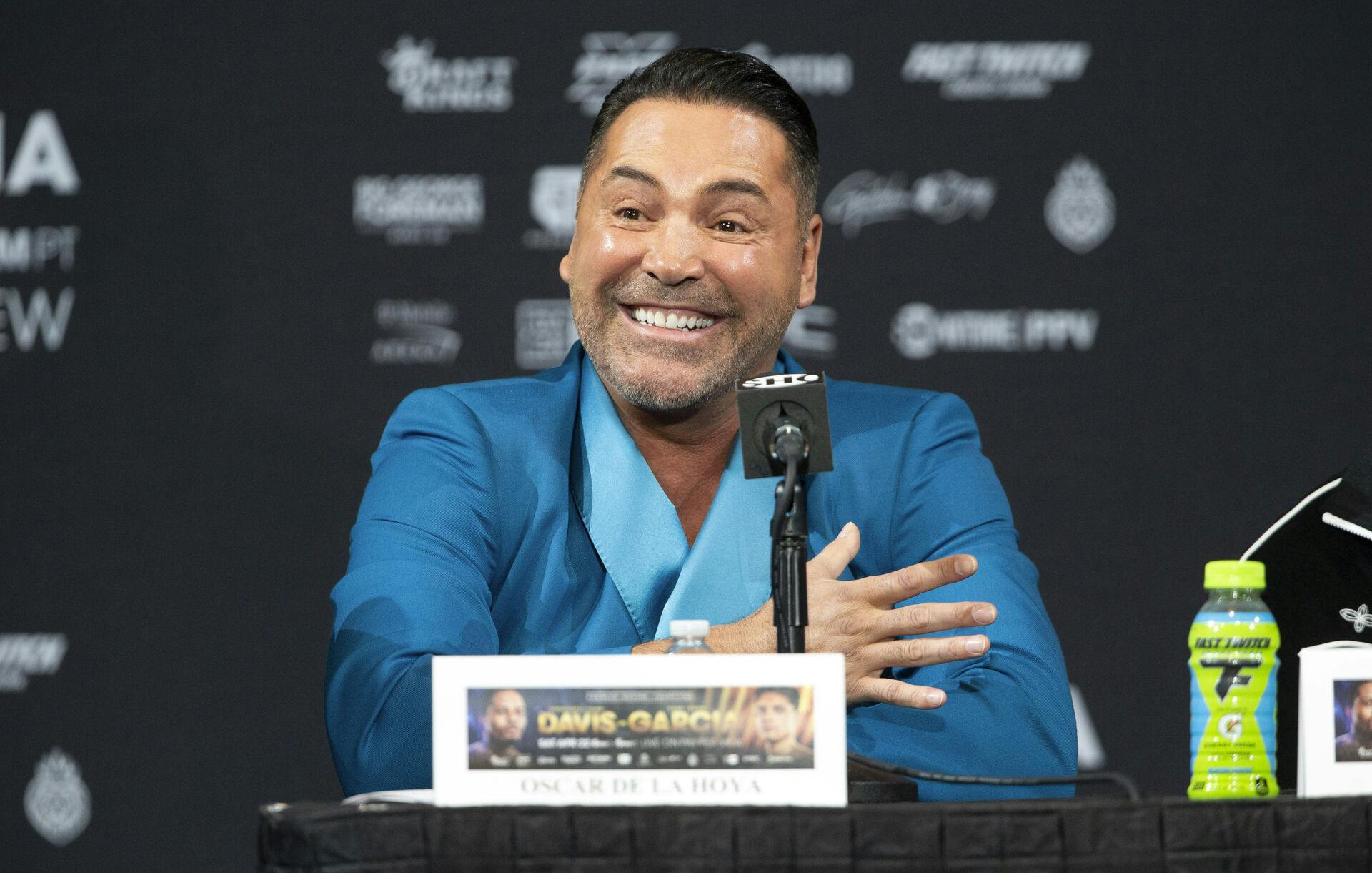 Oscar De La Hoya, promoter for boxer Ryan Garcia, listens to speakers during a news conference Thursday, April 20, 2023, in Las Vegas. Garcia is scheduled to face Gervonta Davis in a bout in Las Vegas on Saturday. (Steve Marcus/Las Vegas Sun via AP)