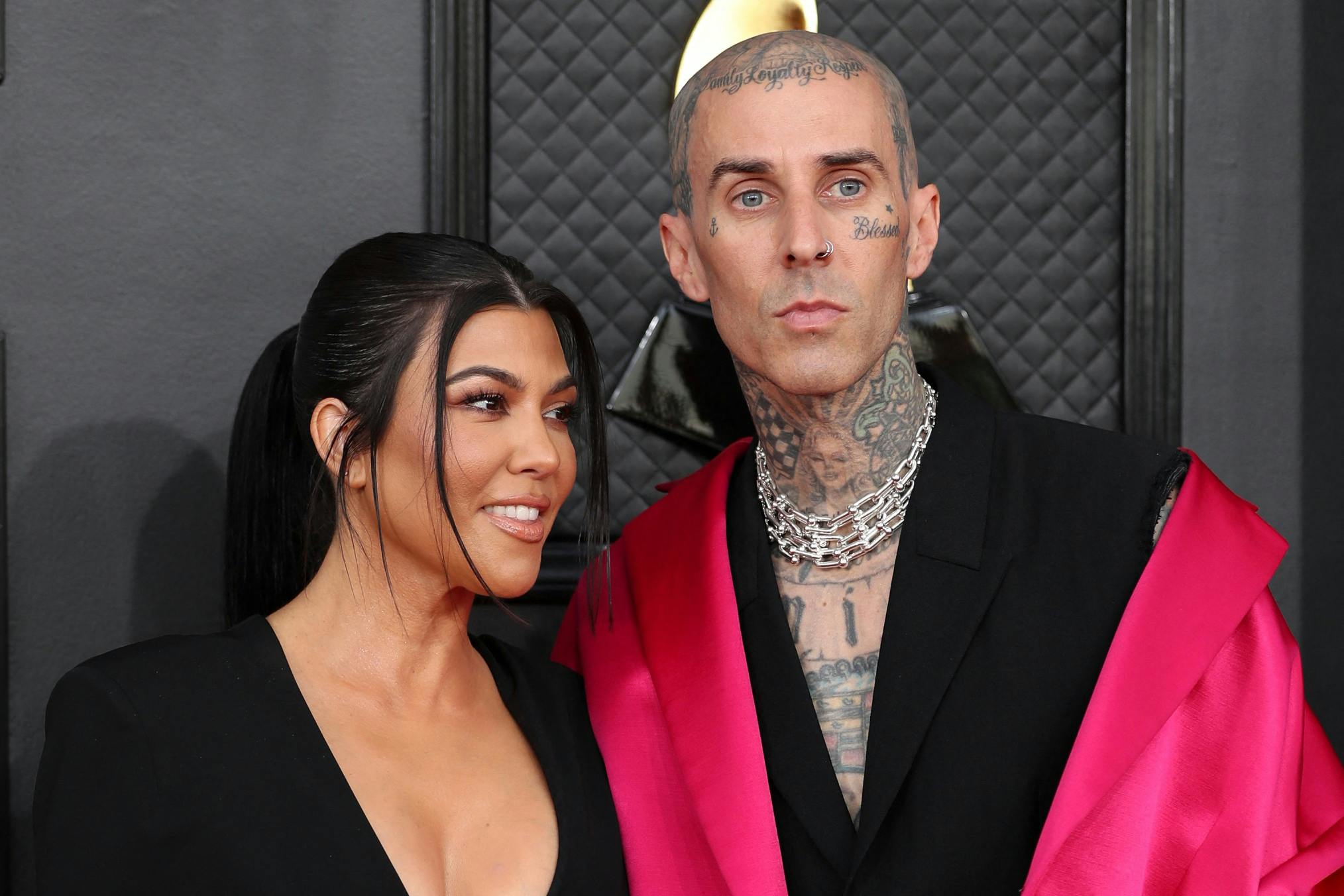 Kourtney Kardashian and Travis Barker pose on the red carpet at the 64th Annual Grammy Awards at the MGM Grand Garden Arena in Las Vegas, Nevada, U.S., April 3, 2022. REUTERS/Maria Alejandra Cardona