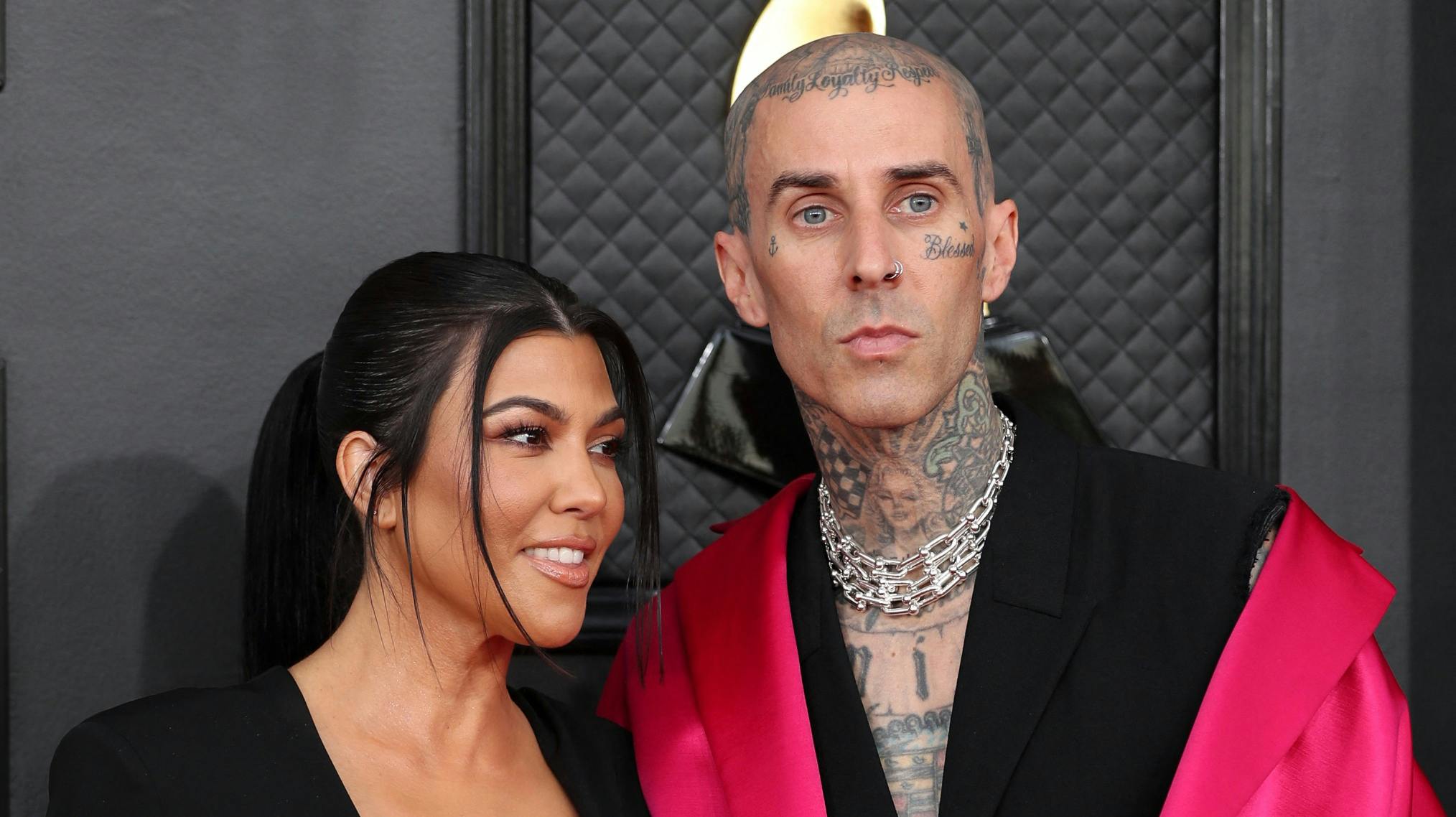 Kourtney Kardashian and Travis Barker pose on the red carpet at the 64th Annual Grammy Awards at the MGM Grand Garden Arena in Las Vegas, Nevada, U.S., April 3, 2022. REUTERS/Maria Alejandra Cardona