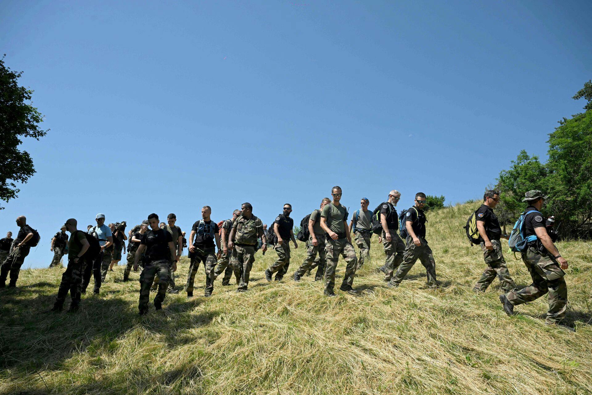 French gendarmes take part in a search operation for two-and-a-half-year-old Emile who is reported missing for two days, on July 10, 2023 in the French southern Alps village of Le Vernet. Emile was last seen playing in the garden at his grandparents' house on July 8, 2023. The scope of research has been extended, the Mayor said on Monday 10, 2023. (Photo by NICOLAS TUCAT / AFP)