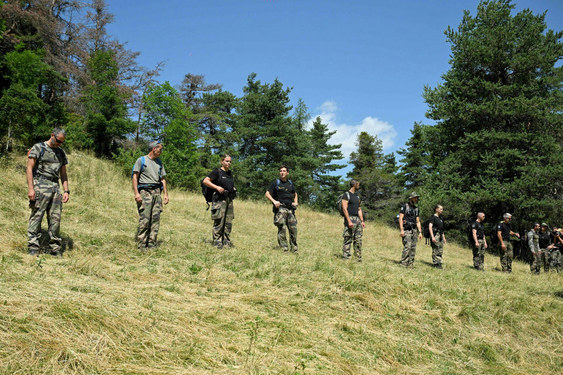French gendarmes take part in a search operation for two-and-a-half-year-old Emile who is reported missing for two days, on July 10, 2023 in the French southern Alps village of Le Vernet. Emile was last seen playing in the garden at his grandparents' house on July 8, 2023. The scope of research has been extended, the Mayor said on Monday 10, 2023. (Photo by NICOLAS TUCAT / AFP)