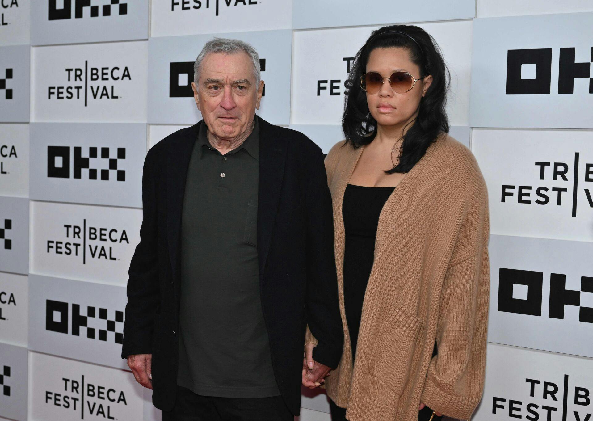 US actor Robert De Niro and his girlfriend Tiffany Chen arrive to the screening of "Kiss the Future" during the opening night of the Tribeca Film Festival at OKX Theater in New York City on June 7, 2023. (Photo by ANGELA WEISS / AFP)