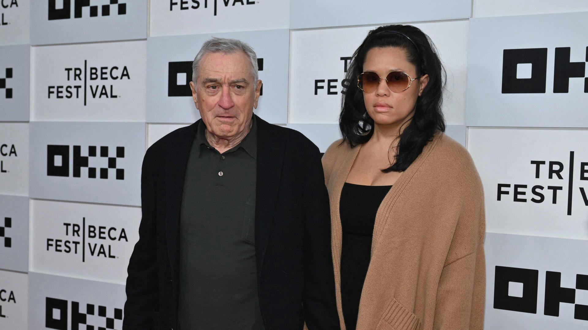 US actor Robert De Niro and his girlfriend Tiffany Chen arrive to the screening of "Kiss the Future" during the opening night of the Tribeca Film Festival at OKX Theater in New York City on June 7, 2023. (Photo by ANGELA WEISS / AFP)