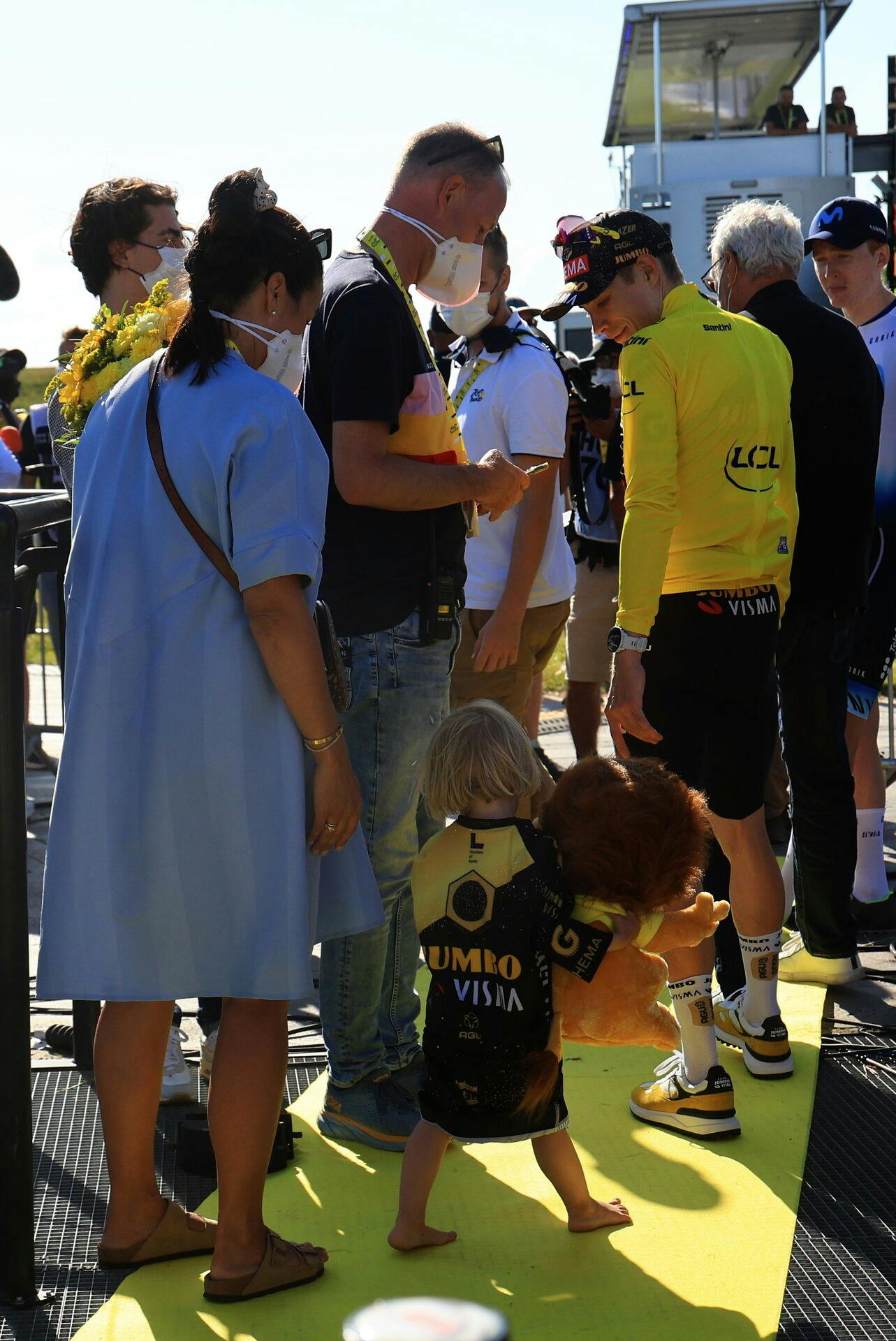 epa10736581 Yellow Jersey overall leader Danish rider Jonas Vingegaard (C-R) of team Jumbo-Visma is accompanied by his wife Trine Maria Hansen (L) and their daughter Frida (C) after the 9th stage of the Tour de France 2023, a 184kms race from Saint-Leonard-de-Noblat to Puy de Dome, France, 09 July 2023. EPA/MARTIN DIVISEK