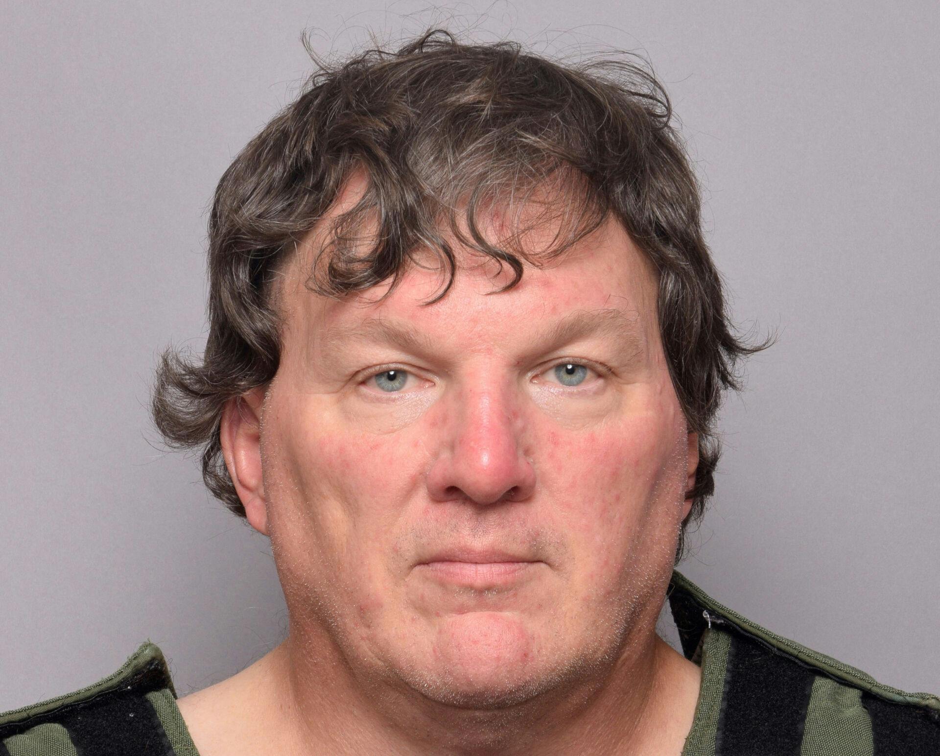 Rex A. Heuermann, an architect in his late 50s who lived a 20-minute drive from Gilgo Beach in Massapequa Park, appears in a jail booking photo provided by the Suffolk County Sheriff's Office in Yaphank, New York, U.S. July 14, 2023. Suffolk County Sheriff's Office/Handout via REUTERS THIS IMAGE HAS BEEN SUPPLIED BY A THIRD PARTY.