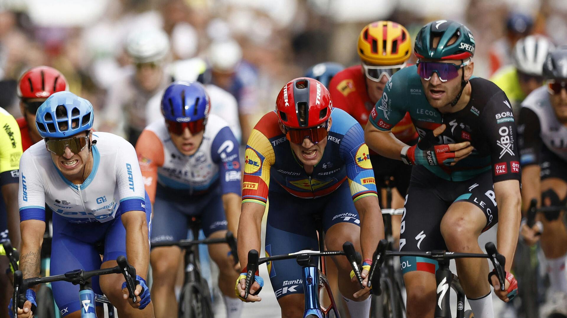 Cycling - Tour de France - Stage 21 - Saint-Quentin-En-Yvelines to Paris Champs-Elysees - France - July 23, 2023 Bora-Hansgrohe's Jordi Meeus crosses the finish line to win stage 21 REUTERS/Stephane Mahe