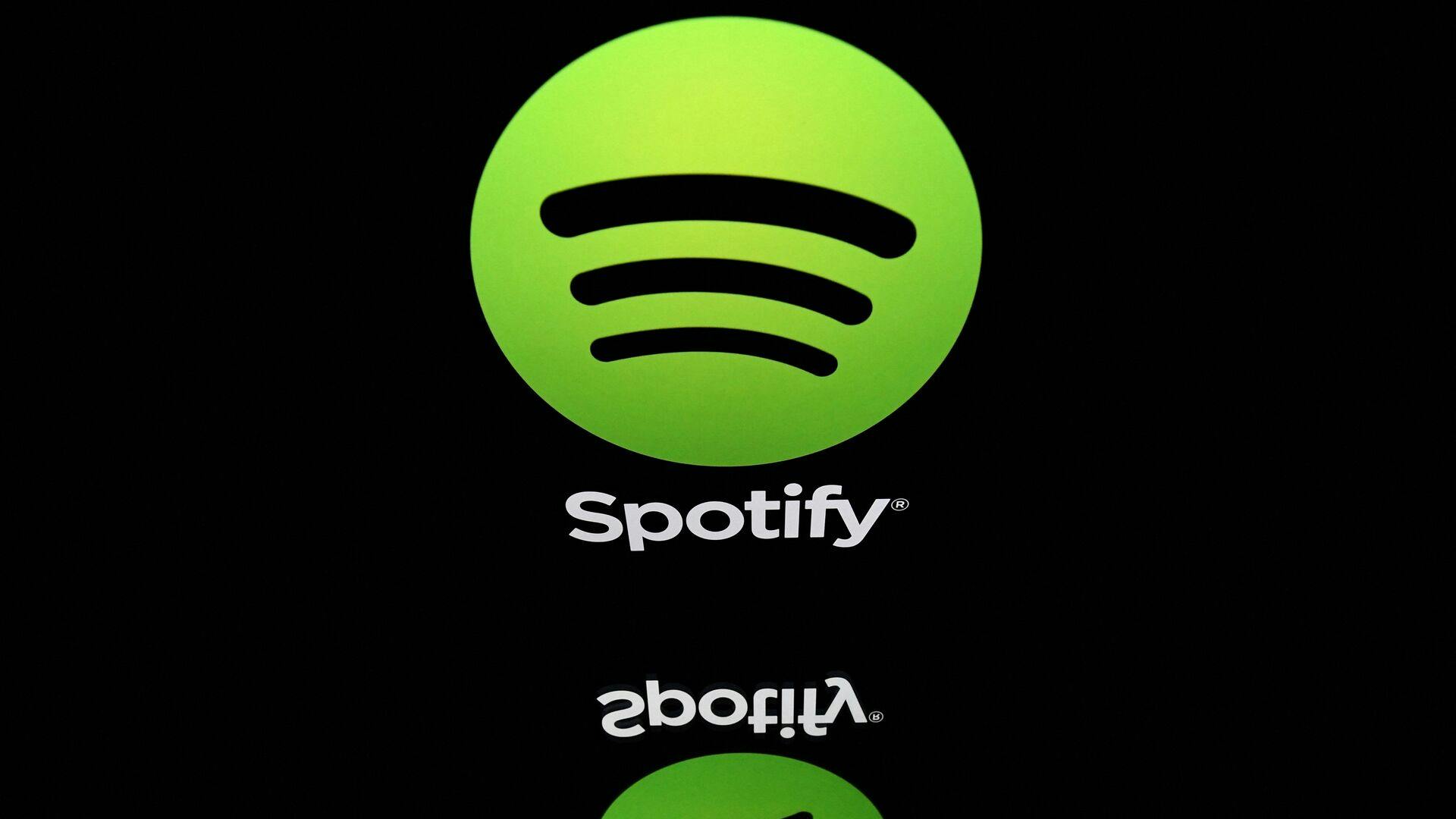 (FILES) This file illustration photo taken on April 19, 2018 shows the logo of online streaming music service Spotify displayed on a tablet screen in Paris. - Music streaming giant Spotify on April 25, 2023 reported that it had 515 million monthly active users as of the end of March, beating expectations, as its losses deepened. (Photo by Lionel BONAVENTURE / AFP)