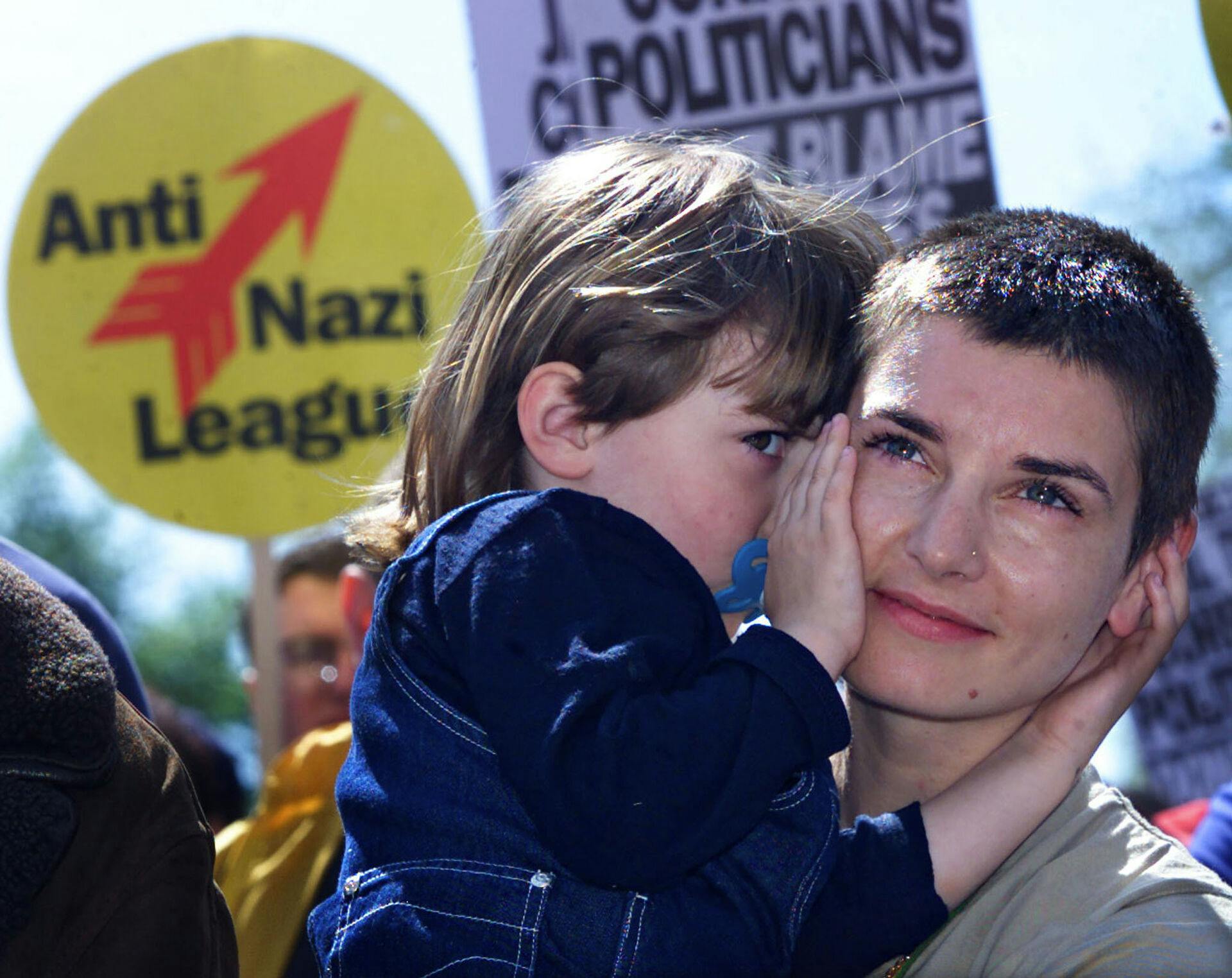 Irish singer Sinead O'Connor (R) hugs her daughter Roisin during an Anti-Racism demonstration in Dublin city centre, May 13. Thousands of Irish people gathered to protest against recent racist attacks and increasing racial tension in Ireland.