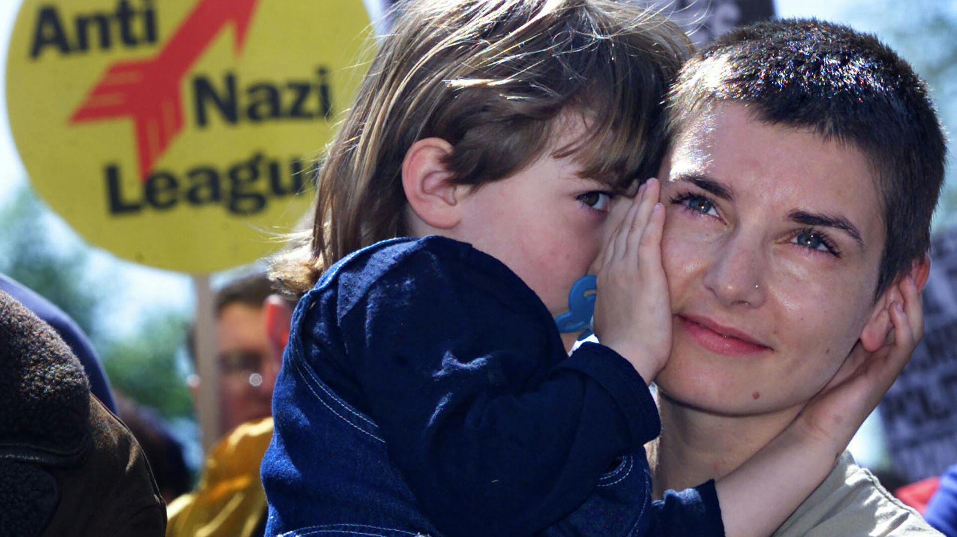 Irish singer Sinead O'Connor (R) hugs her daughter Roisin during an Anti-Racism demonstration in Dublin city centre, May 13. Thousands of Irish people gathered to protest against recent racist attacks and increasing racial tension in Ireland.