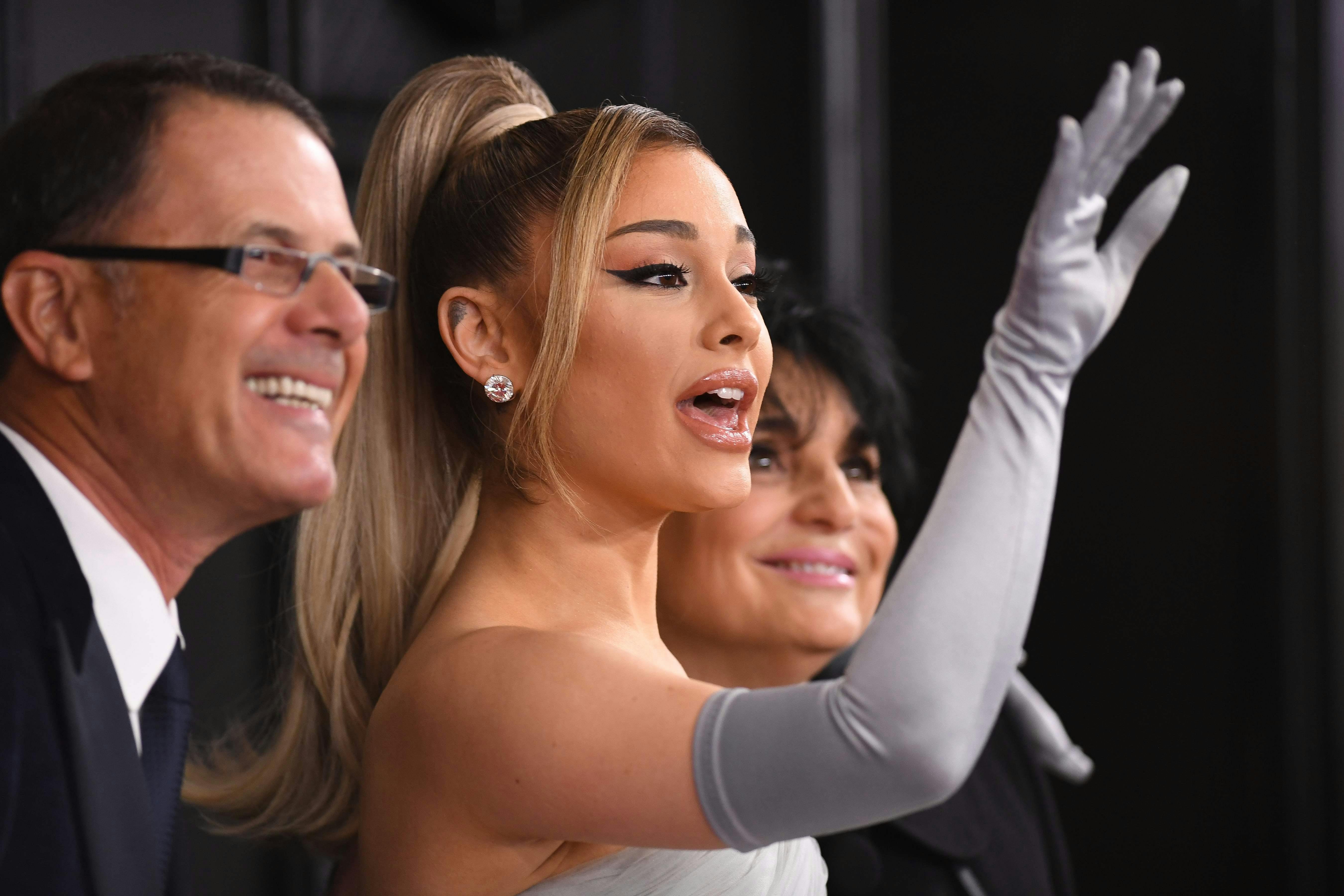 US singer-songwriter Ariana Grande arrives with her parents Joan Grande and Edward Butera for the 62nd Annual Grammy Awards on January 26, 2020, in Los Angeles. (Photo by VALERIE MACON / AFP)