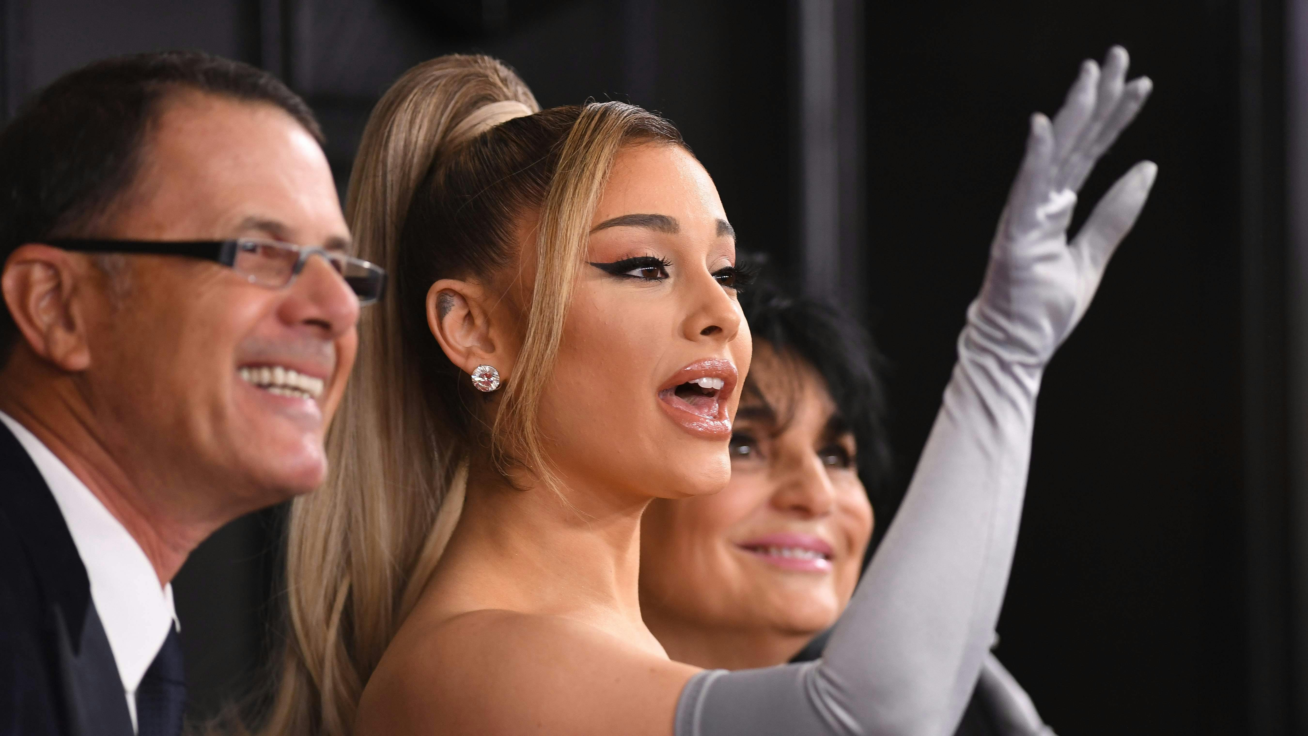 US singer-songwriter Ariana Grande arrives with her parents Joan Grande and Edward Butera for the 62nd Annual Grammy Awards on January 26, 2020, in Los Angeles. (Photo by VALERIE MACON / AFP)