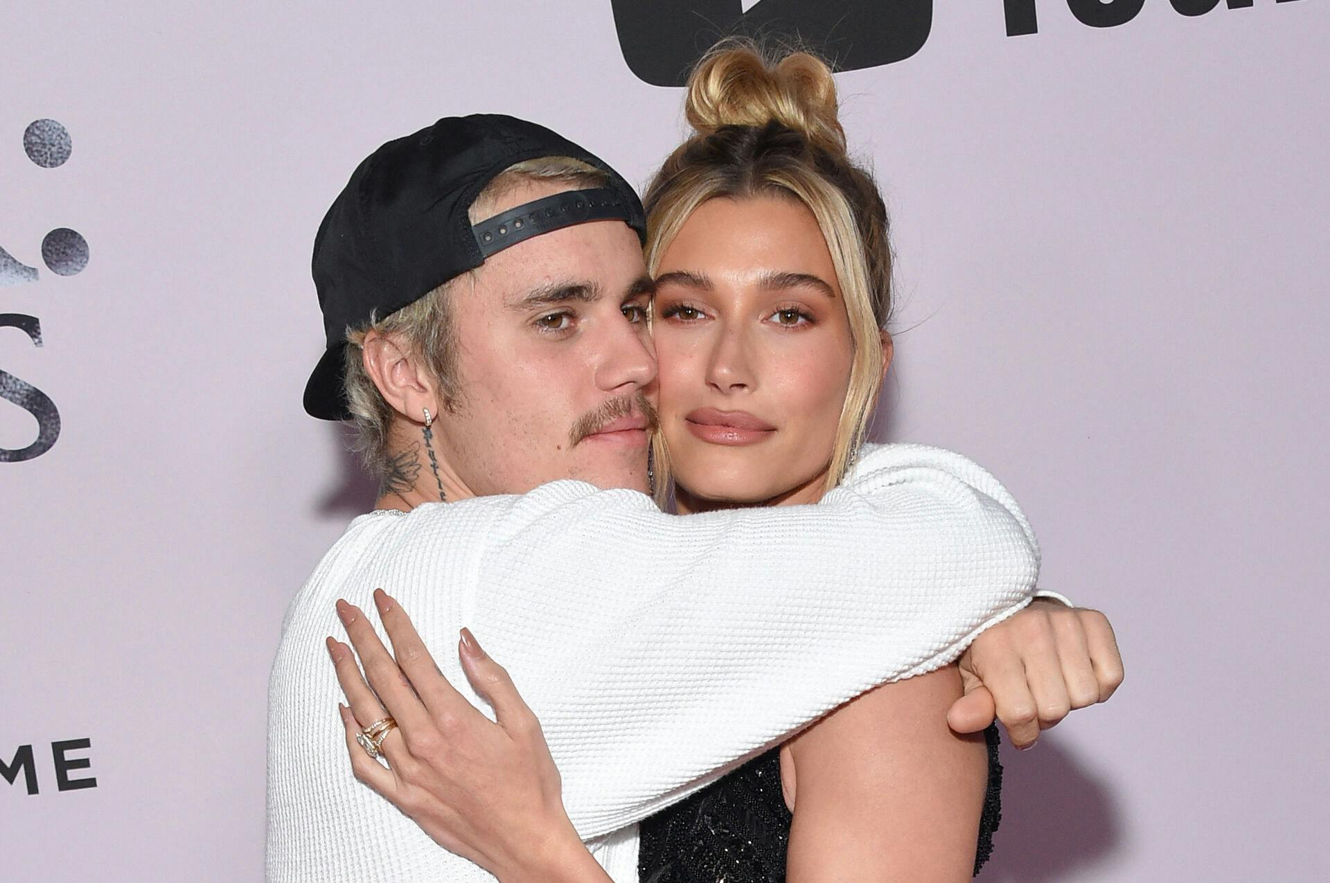 Canadian singer Justin Bieber (L) and wife US model Hailey Bieber arrive for YouTube Originals' "Justin Bieber: Seasons" premiere at the Regency Bruin Theatre in Los Angeles on January 27, 2020.  Lisa O'CONNOR / AFP