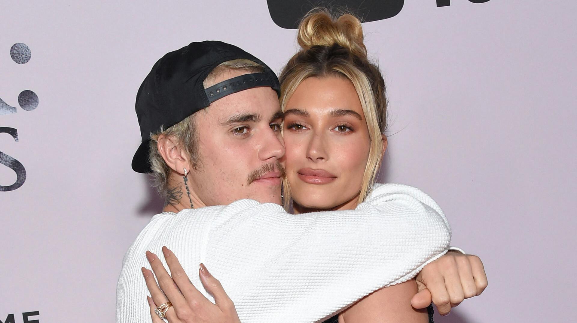 Canadian singer Justin Bieber (L) and wife US model Hailey Bieber arrive for YouTube Originals' "Justin Bieber: Seasons" premiere at the Regency Bruin Theatre in Los Angeles on January 27, 2020.  Lisa O'CONNOR / AFP
