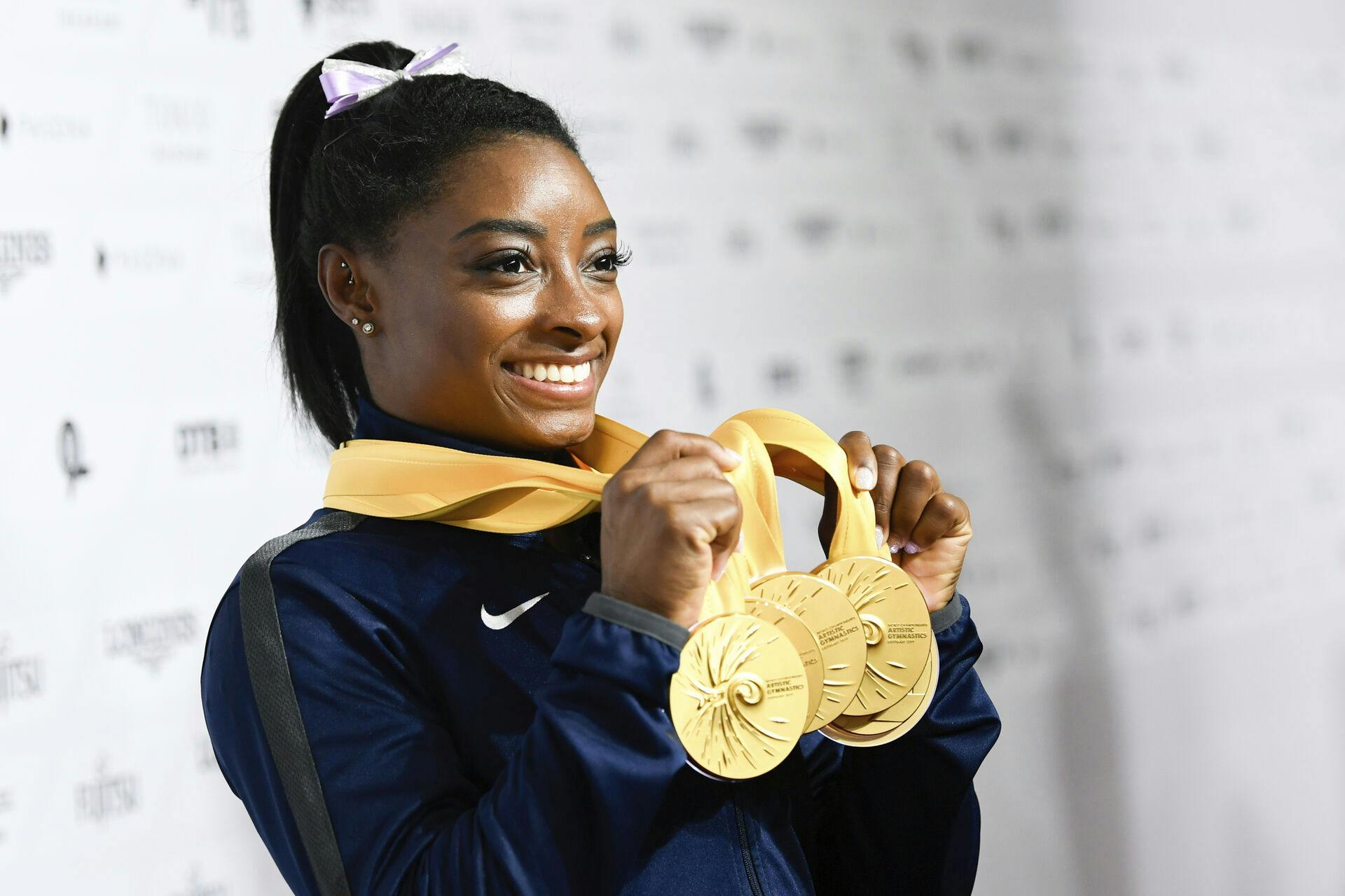 13 October 2019, Baden-Wuerttemberg, Stuttgart: Gymnastics: World Championships, apparatus finals, women: Simone Biles from the USA has five gold medals in her hands. Photo by: Tom Weller/picture-alliance/dpa/AP Images