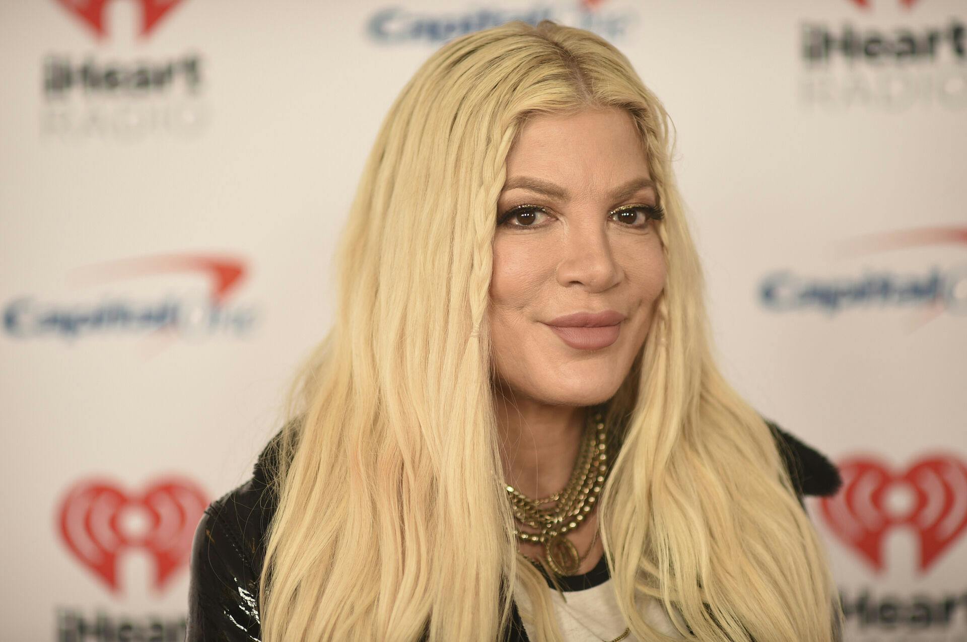 Tori Spelling arrives at iHeartRadio's ALTer EGO on Saturday, Jan. 14, 2023, at the Kia Forum in Inglewood, Calif. (Photo by Richard Shotwell/Invision/AP)