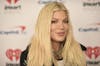 Tori Spelling arrives at iHeartRadio's ALTer EGO on Saturday, Jan. 14, 2023, at the Kia Forum in Inglewood, Calif. (Photo by Richard Shotwell/Invision/AP)