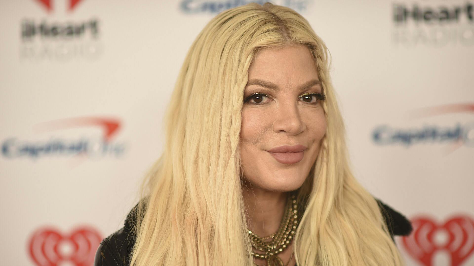 Tori Spelling arrives at iHeartRadio's ALTer EGO on Saturday, Jan. 14, 2023, at the Kia Forum in Inglewood, Calif. (Photo by Richard Shotwell/Invision/AP)
