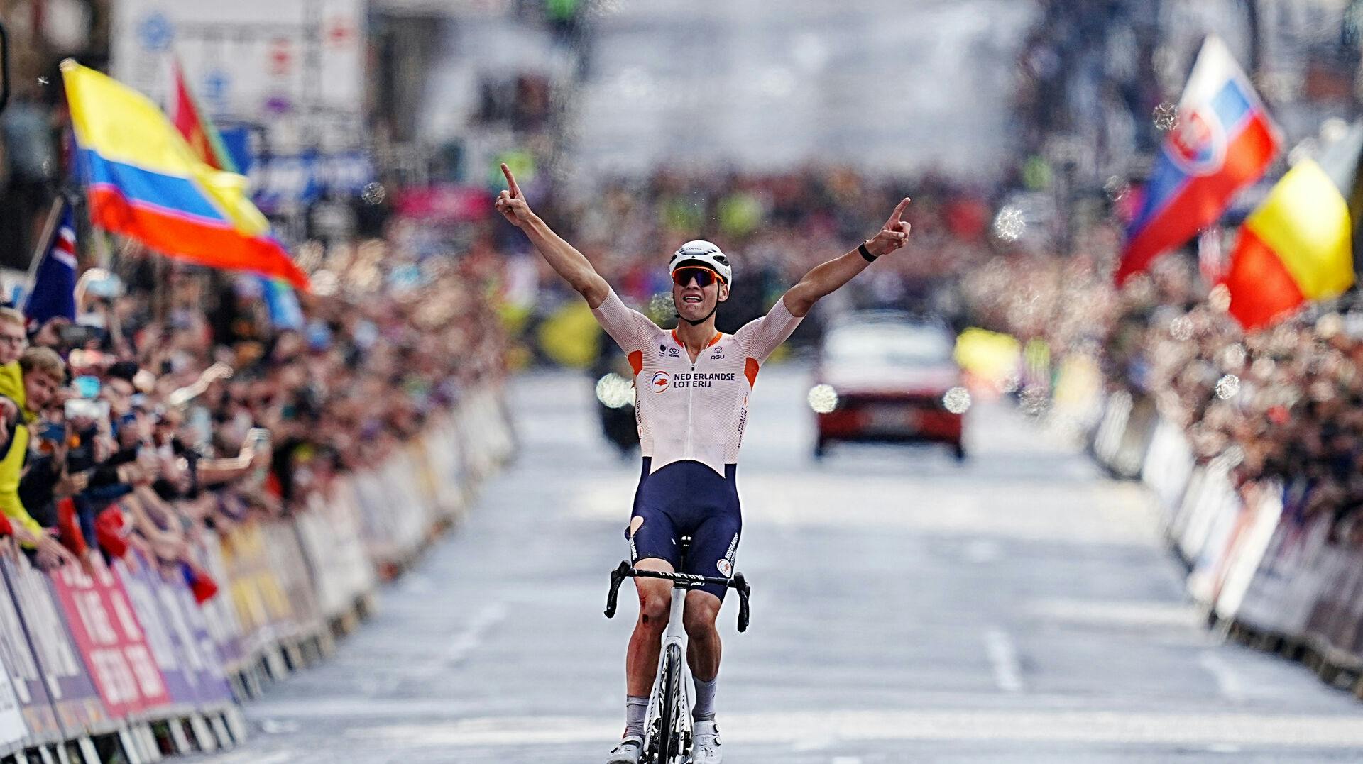 Cycling - UCI World Championships 2023 - Glasgow, Scotland, Britain - August 6, 2023 Netherlands' Mathieu van der Poel celebrates as he crosses the finish line to win the men's elite road race REUTERS/Maja Smiejkowska