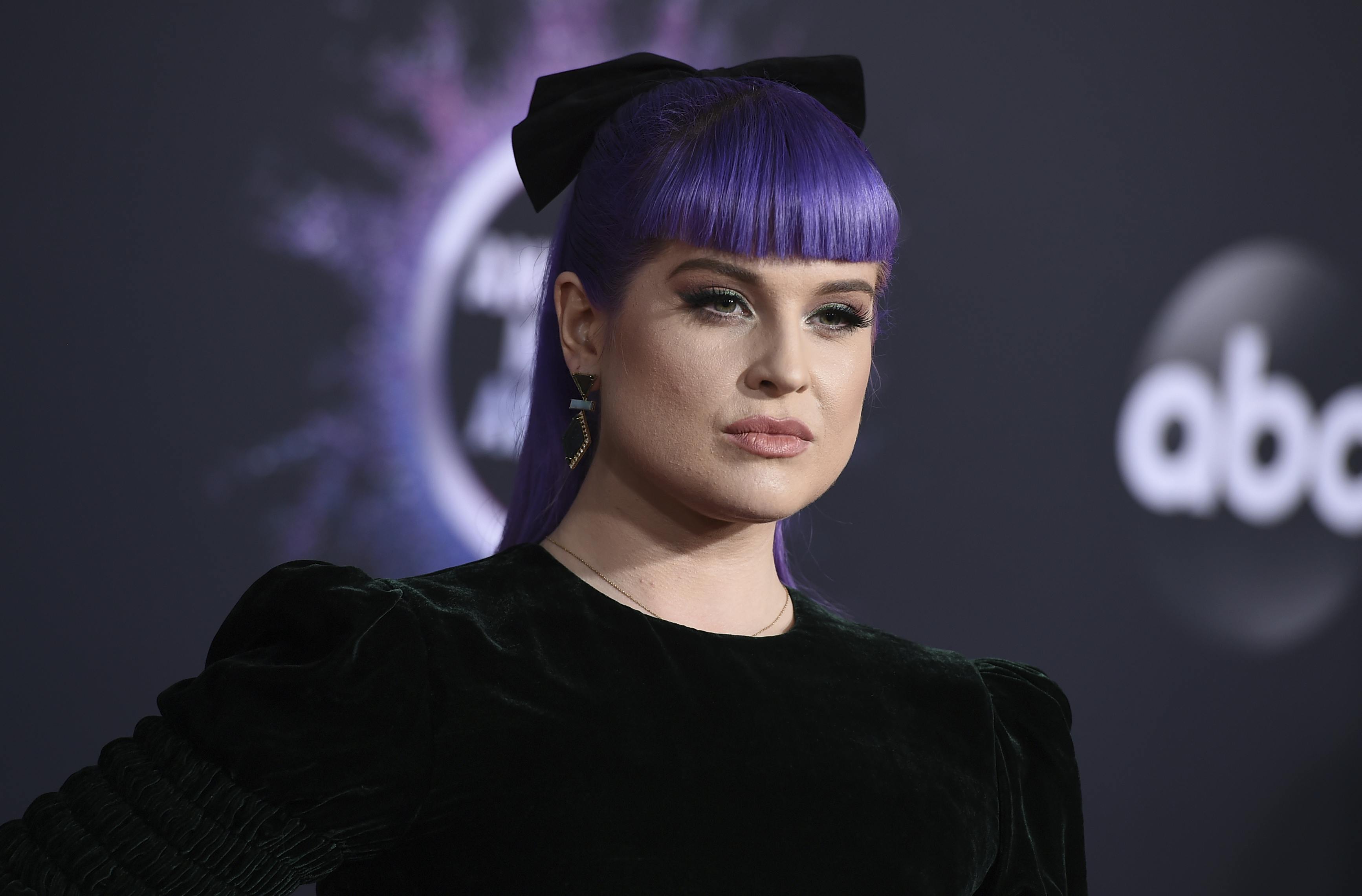 Kelly Osbourne arrives at the American Music Awards on Sunday, Nov. 24, 2019, at the Microsoft Theater in Los Angeles. (Photo by Jordan Strauss/Invision/AP)
