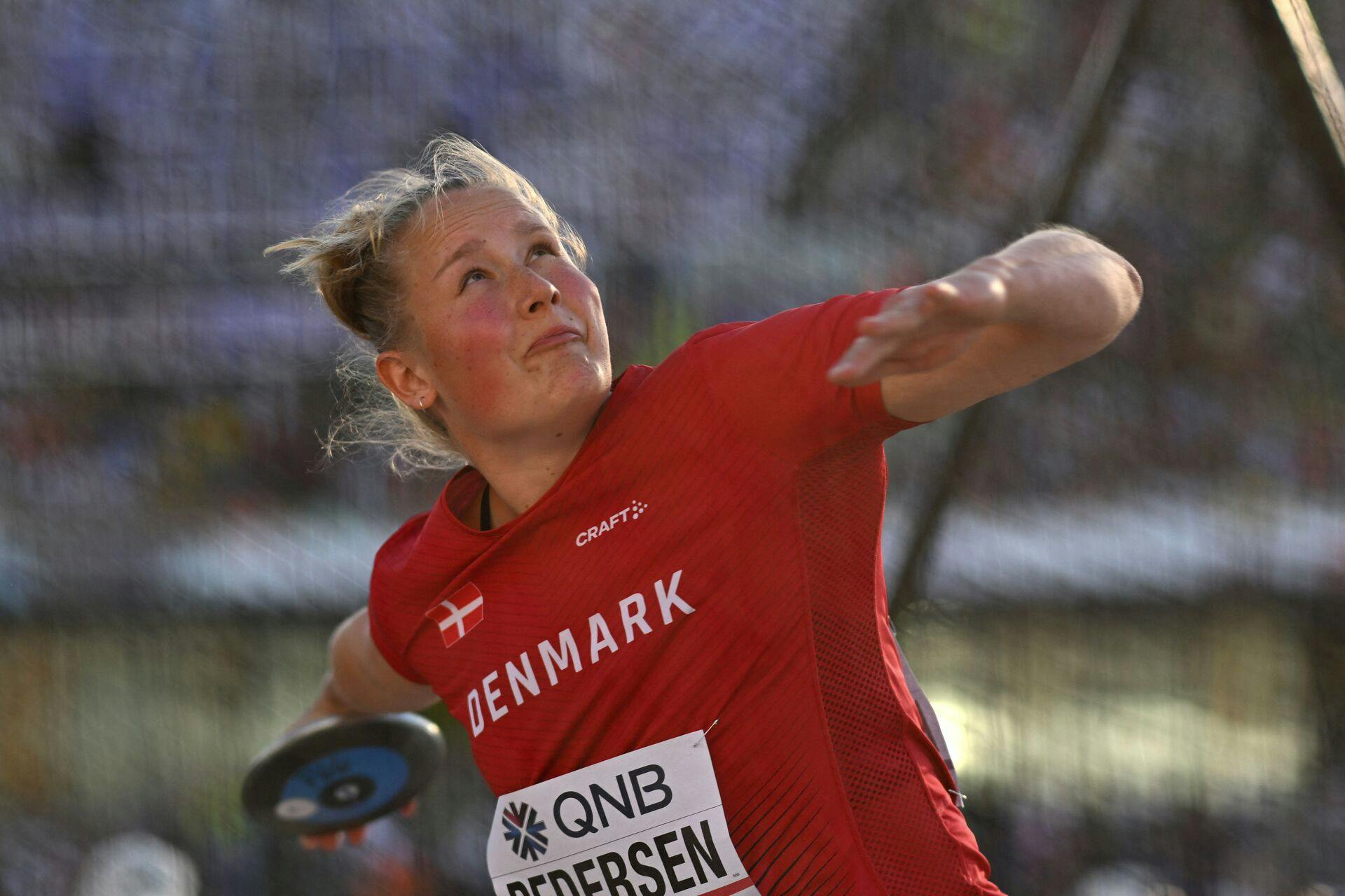 Denmark's Lisa Brix Pedersen competes in the women's discus throw qualification during the World Athletics Championships at Hayward Field in Eugene, Oregon on July 18, 2022. (Photo by ANDREJ ISAKOVIC / AFP)