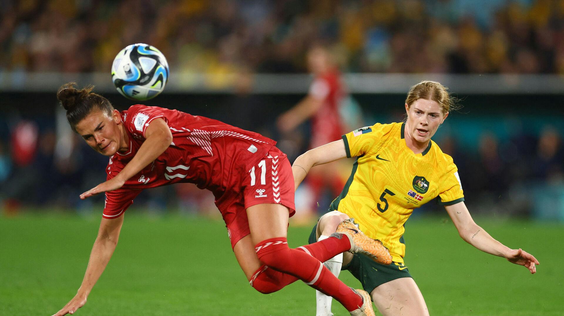 Soccer Football – FIFA Women's World Cup Australia and New Zealand 2023 – Round of 16 – Australia v Denmark – Stadium Australia, Sydney, Australia – August 7, 2023 Denmark's Katrine Veje in action with Australia's Cortnee Vine REUTERS/Carl Recine