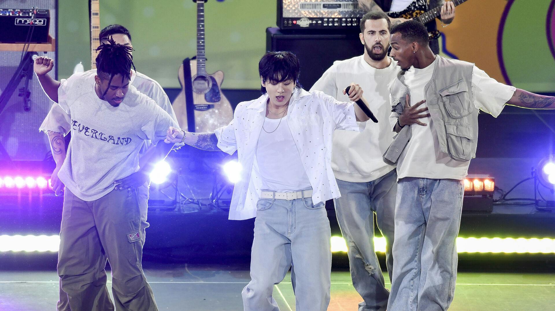 South Korean singer Jung Kook, center, from the K-pop band BTS performs solo on ABC's "Good Morning America" at Rumsey Playfield/SummerStage on Friday, July 14, 2023, in New York. (Photo by Evan Agostini/Invision/AP)