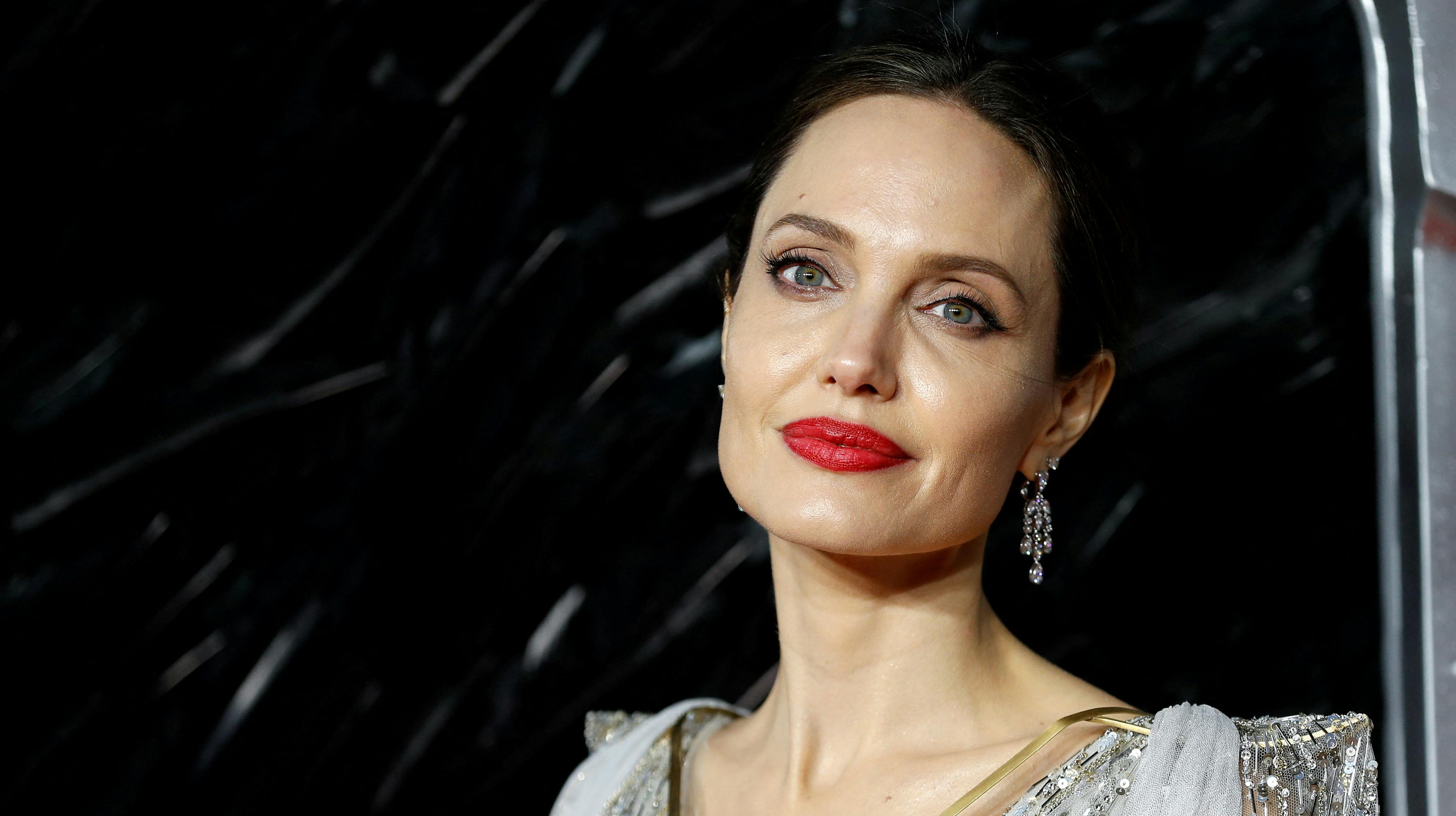 FILE PHOTO: Actor Angelina Jolie poses as she attends the UK premiere of "Maleficent: Mistress of Evil" in London, Britain October 9, 2019. REUTERS/Peter Nicholls/File Photo
