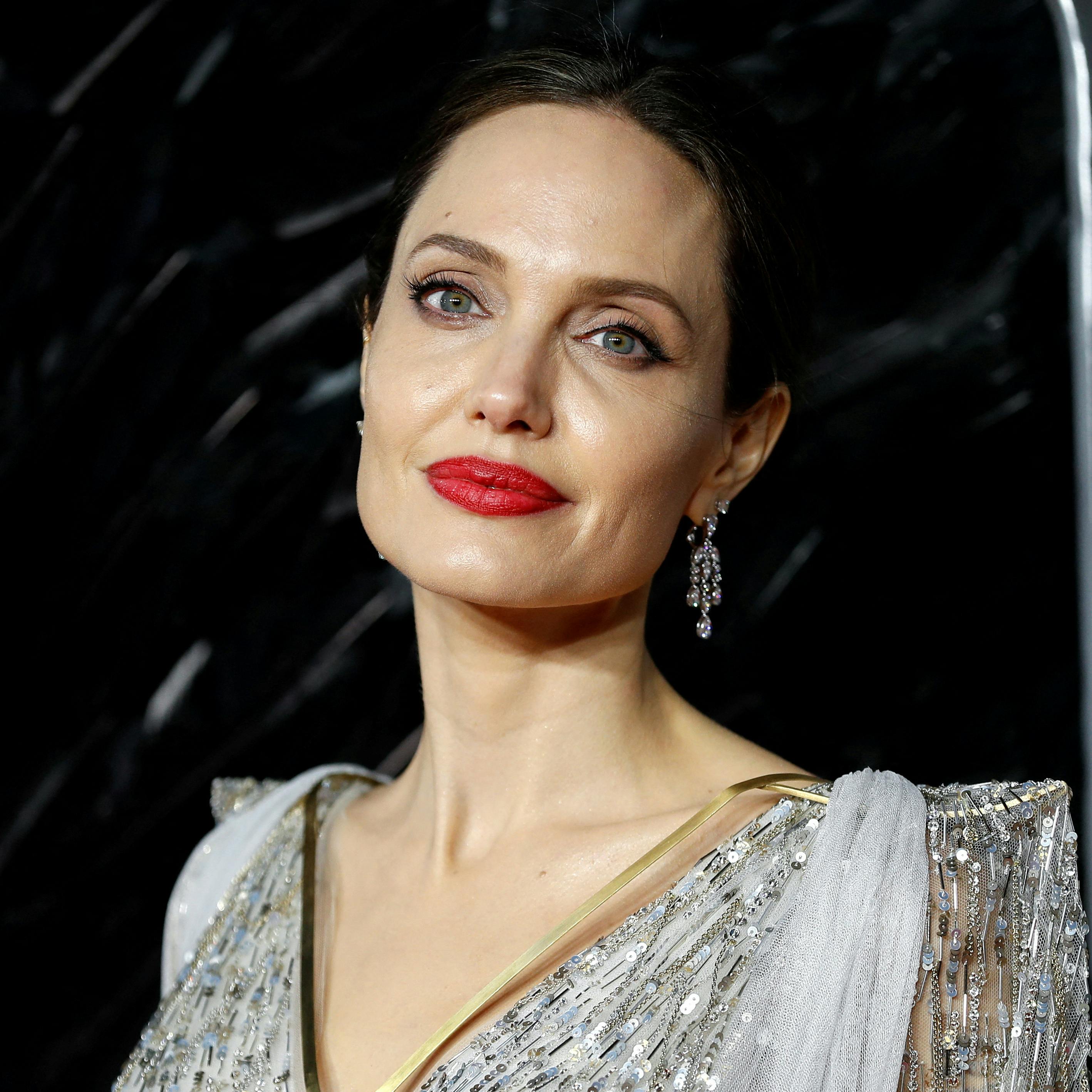 FILE PHOTO: Actor Angelina Jolie poses as she attends the UK premiere of "Maleficent: Mistress of Evil" in London, Britain October 9, 2019. REUTERS/Peter Nicholls/File Photo