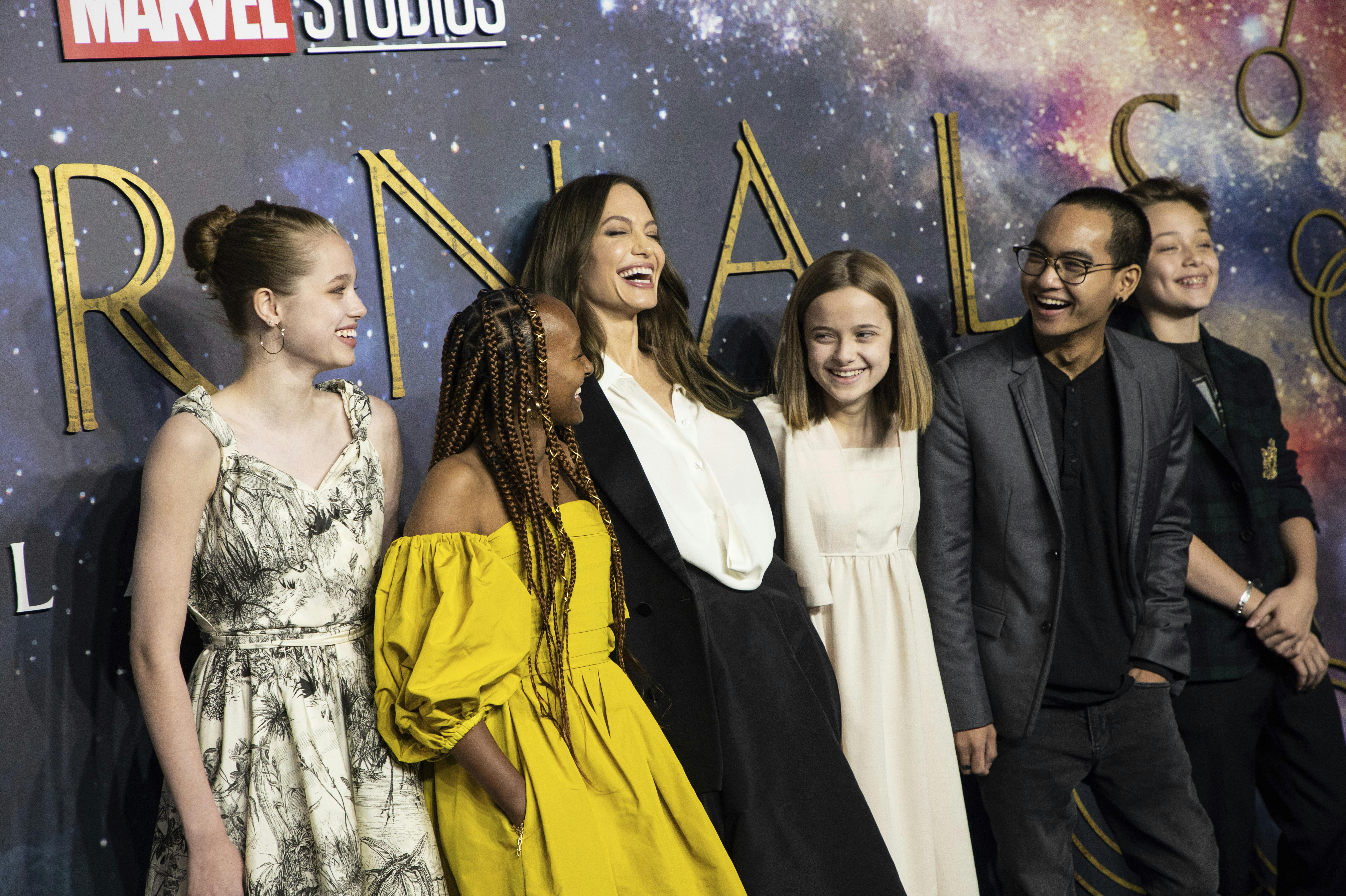 Shiloh Jolie-Pitt, from left, Zahara Jolie-Pitt, Angelina Jolie, Vivienne Jolie-Pitt, Maddox Jolie-Pitt and Knox Jolie-Pitt pose for photographers upon arrival at the premiere of the film 'Eternals' on Wednesday, Oct. 27, 2021 in London. (Photo by Vianney Le Caer/Invision/AP)