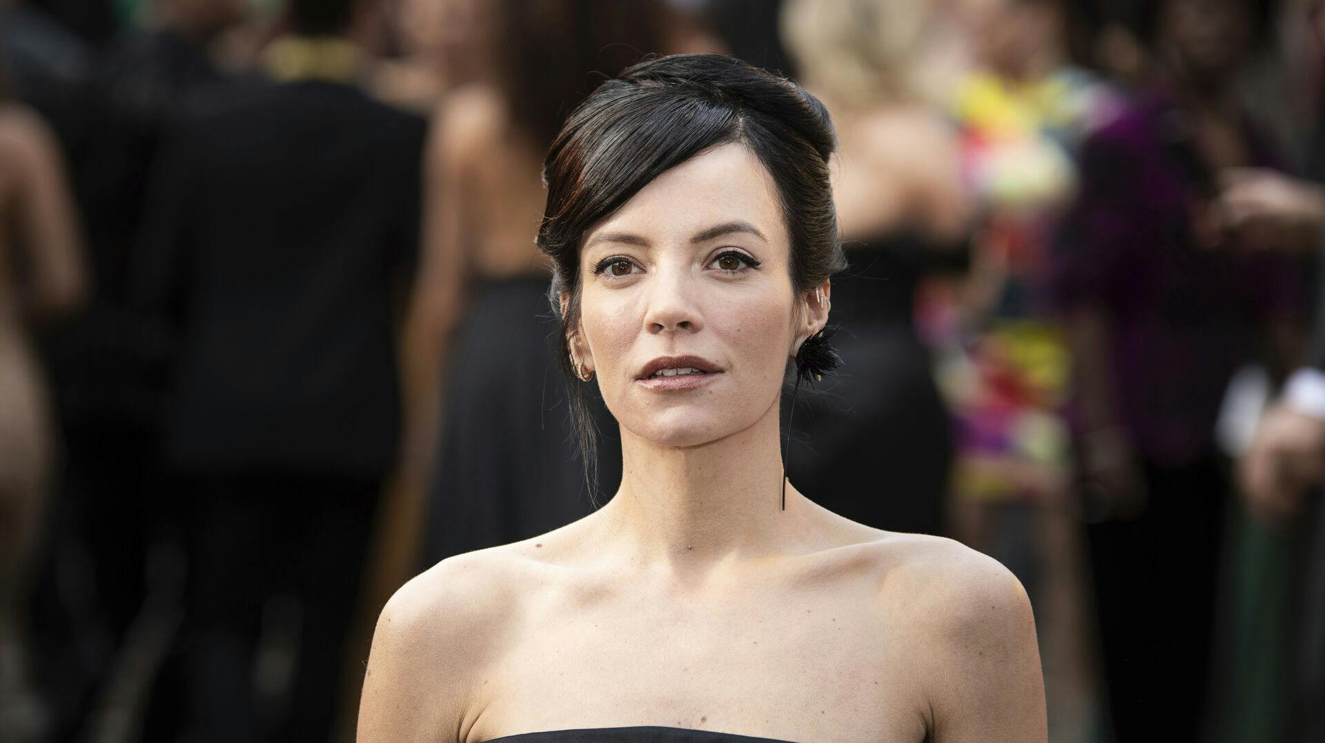 Lily Allen poses for photographers upon arrival at the Olivier Awards in London, Sunday, April 10, 2022. (Photo by Vianney Le Caer/Invision/AP)